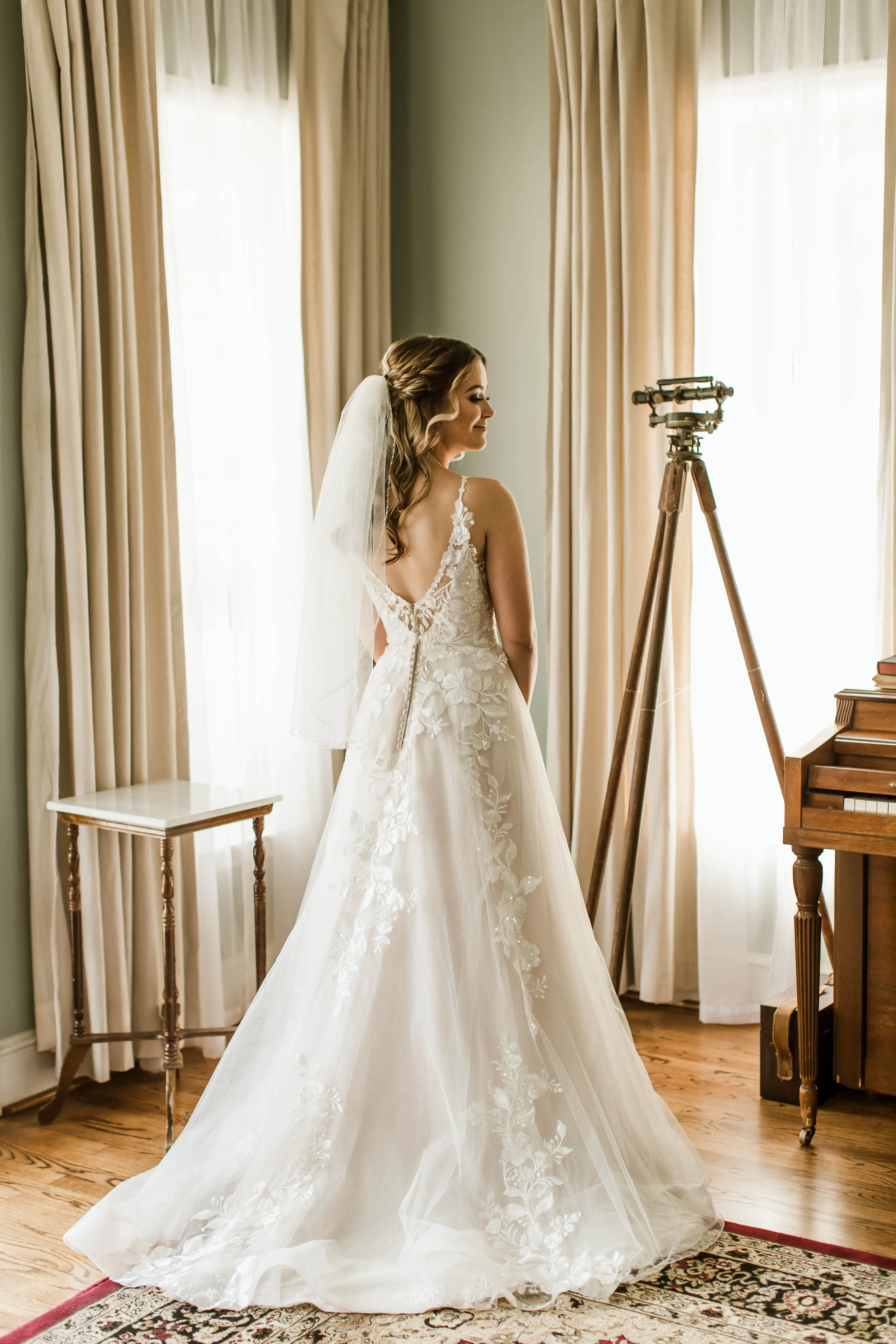 Bride wearing affordable floral ballgown wedding dress.