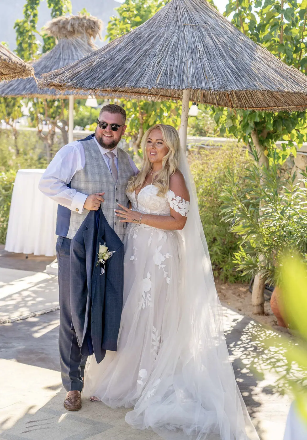 Groom with Bride in Greece Wedding Wearing Sexy Boho Wedding Dress Called Hattie Lane Marie by Rebecca Ingram.