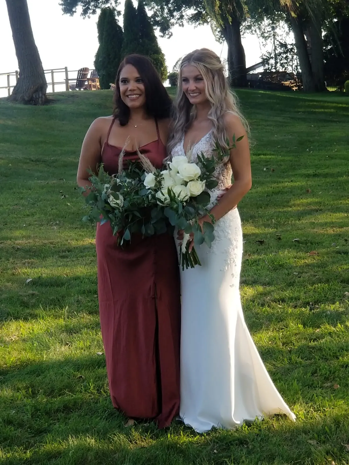 Bride with bridesmaid wearing sexy v back sheath wedding dress