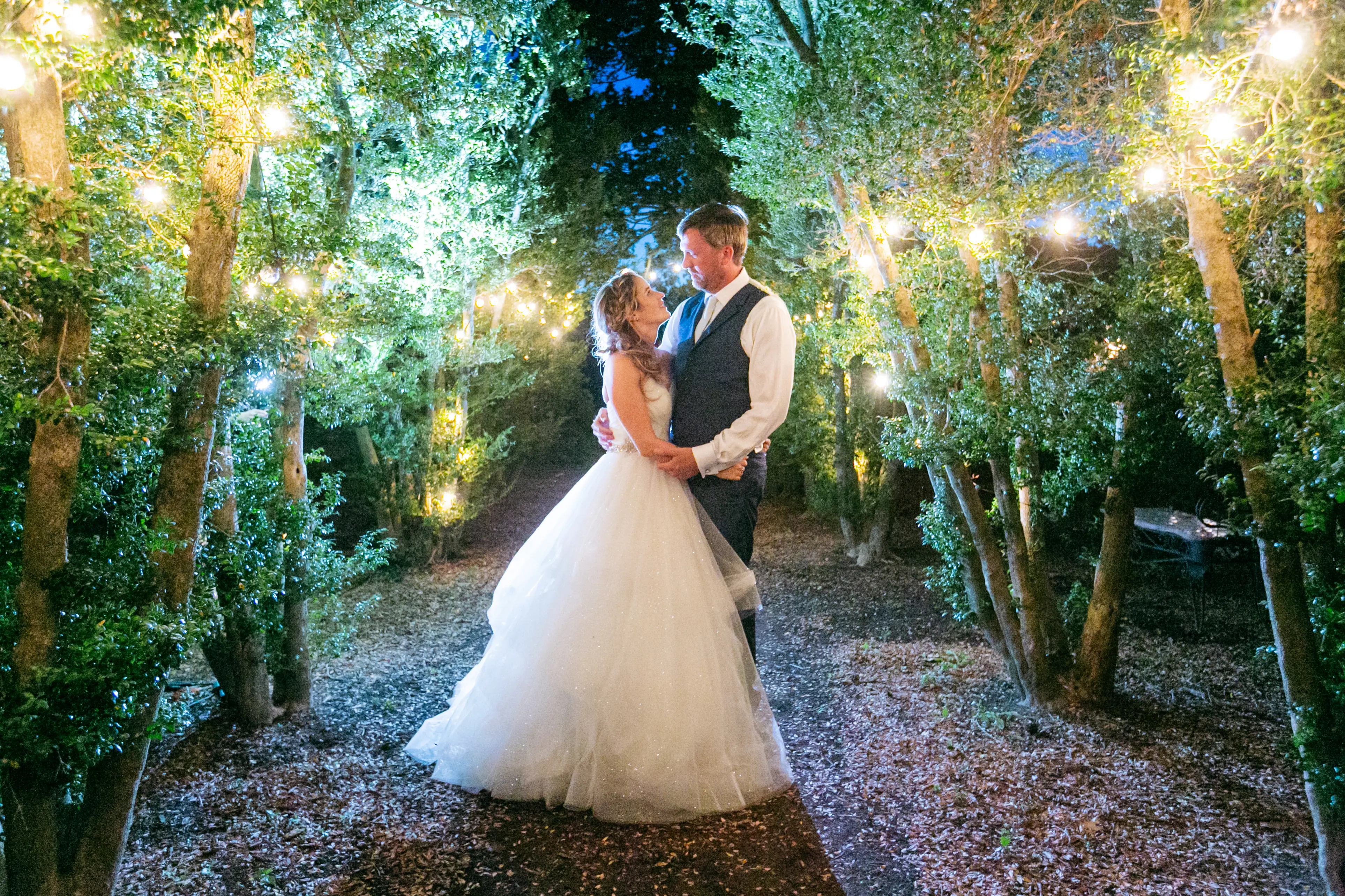 Groom with Bride in Strapless Sweetheart Neckline Ball Gown Wedding Dress Called Yasmin by Maggie Sottero