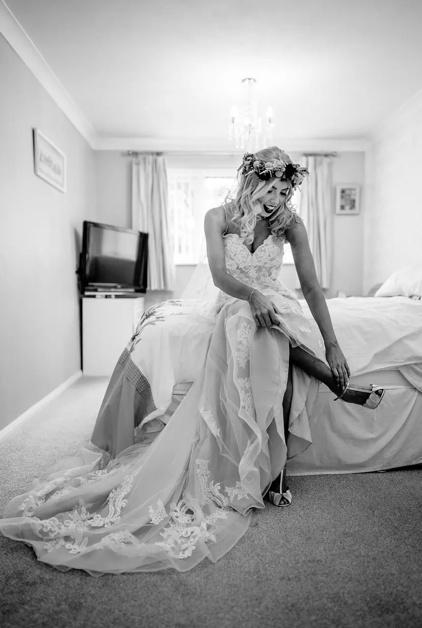 Bride Getting Ready Wearing Elegant Fit-and-Flare Bridal Dress by Maggie Sottero