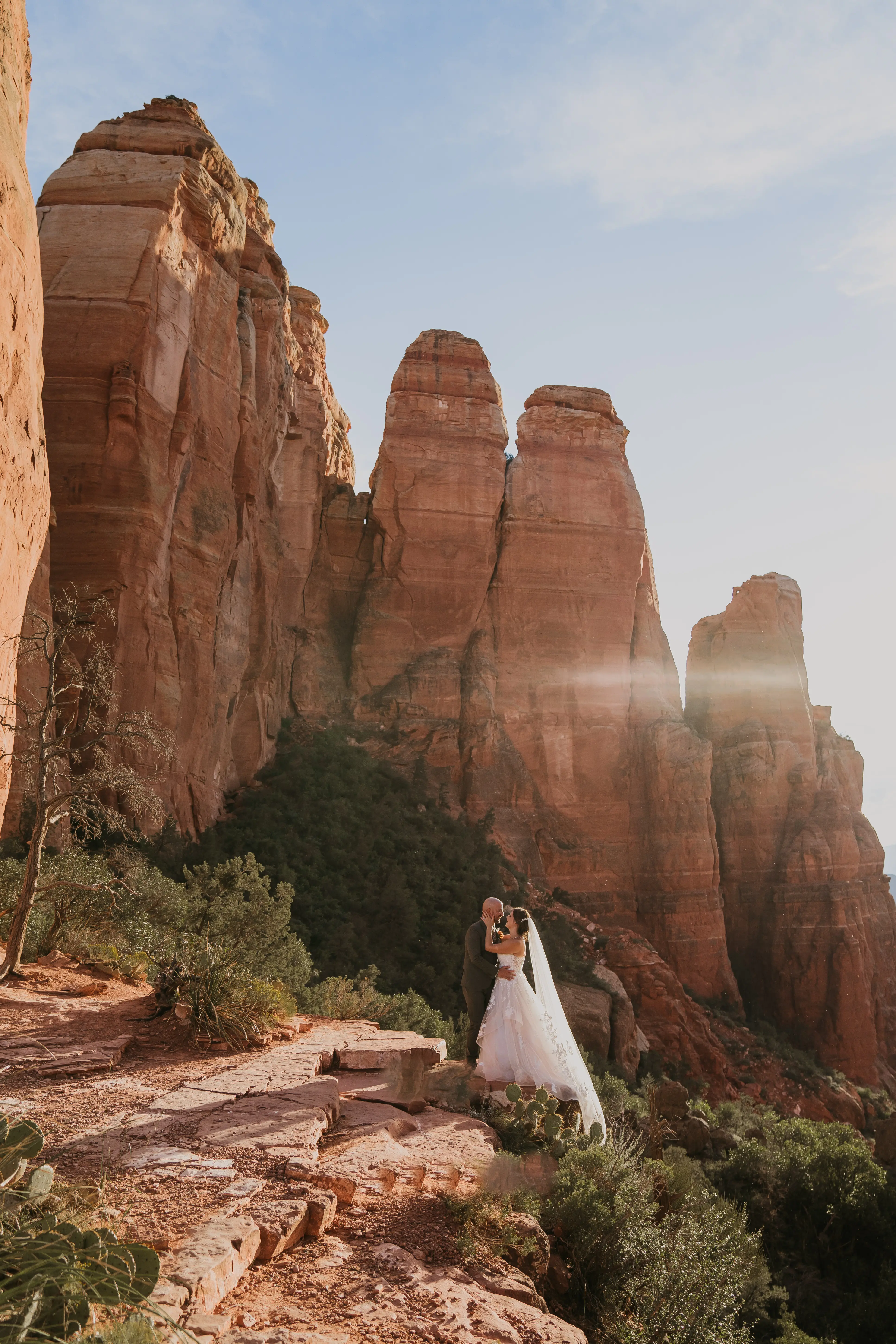 Groom Kissing Bride In Floral Lace Wedding Dress Named Lettie By Rebecca Ingram