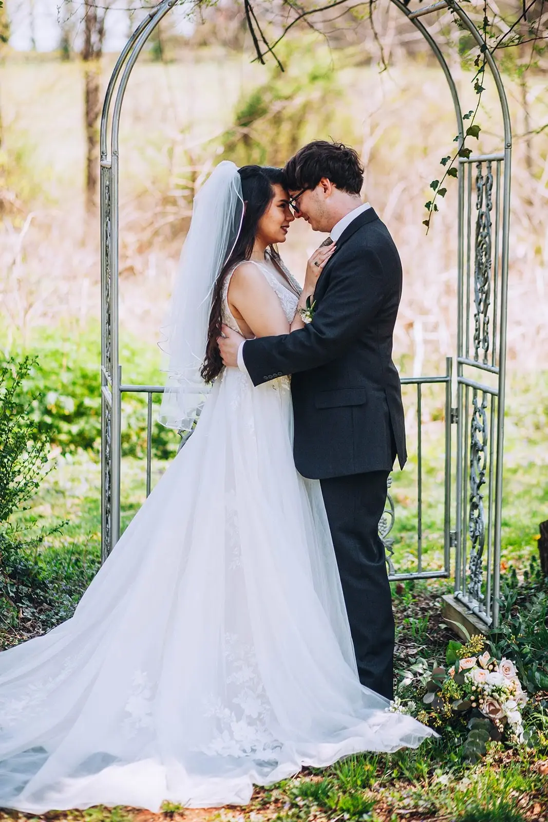 Groom With Bride Wearing Lace A-Line Wedding Dress Raelynn By Rebecca Ingram