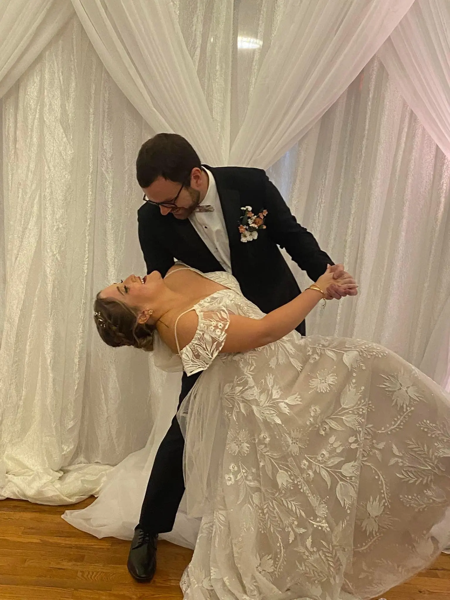 Bride wearing Keisha wedding dress by Maggie Sottero dancing with her husband