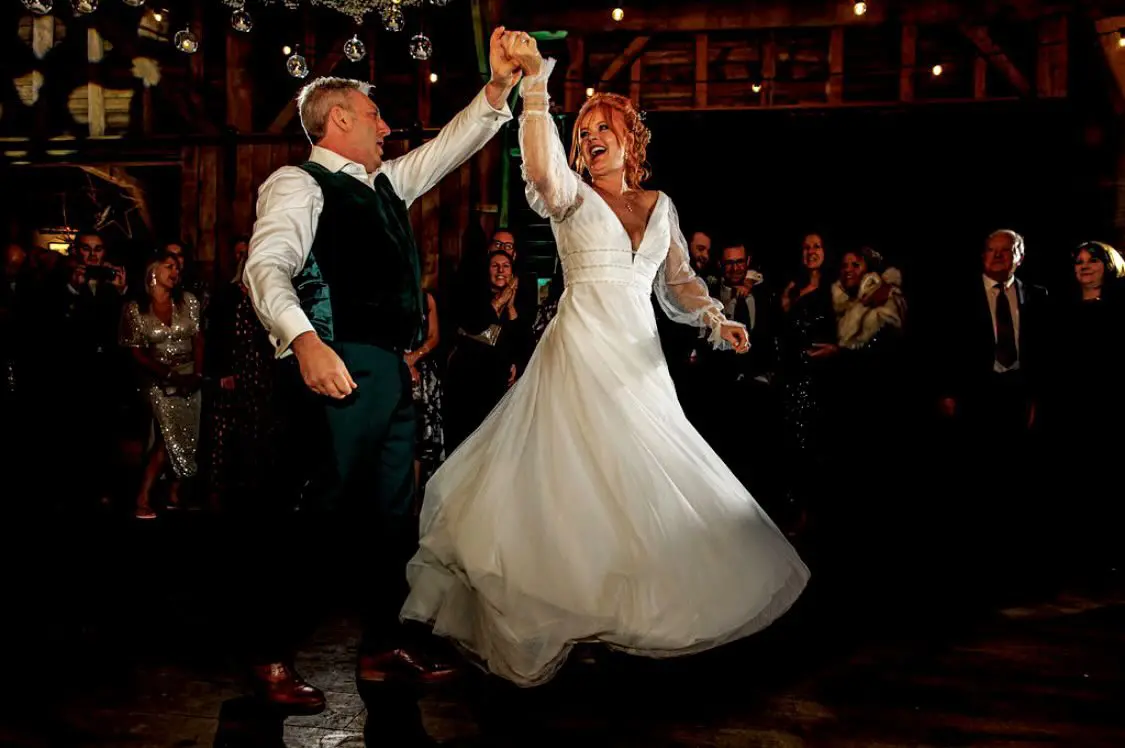 Real Bride in Bishop Sleeve A-Line Wedding Gown Called Joanne by Rebecca Ingram