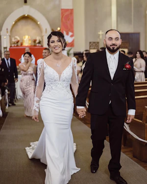 Groom with Bride in Long Illusion Lace Puff Sleeve Mermaid Wedding Gown Called Nikki by Maggie Sottero