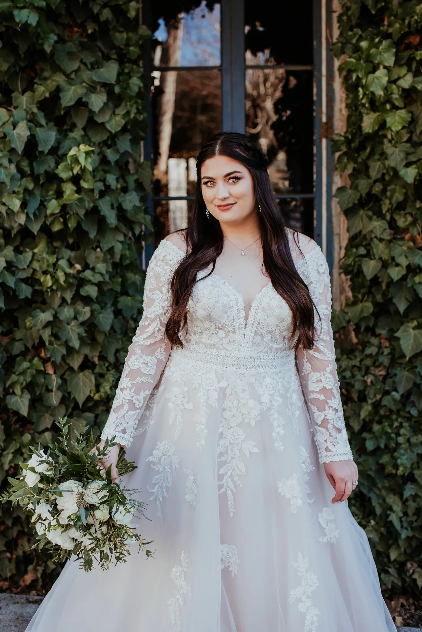 Real Bride wearing long sleeve A-Line wedding dress called Raphael by Maggie Sottero.