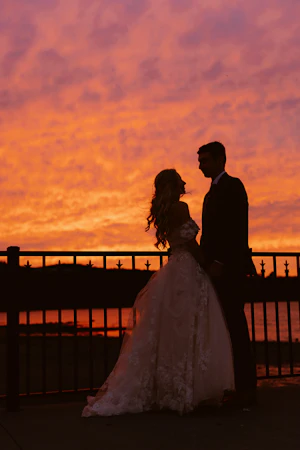 Bride wearing Laila wedding dress by Maggie Sottero standing with her husband
