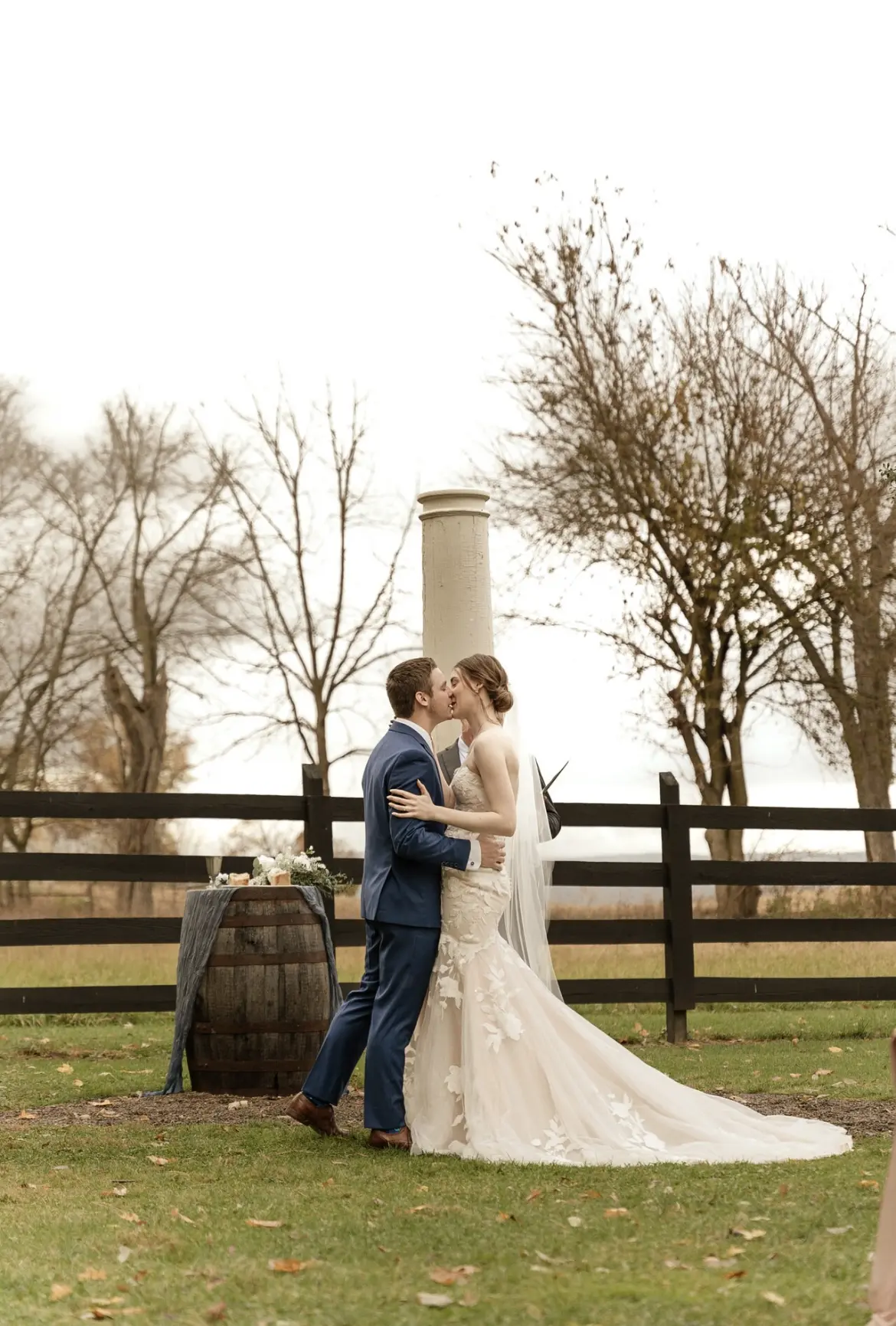 Bride And Groom Share A Kiss. Bride Wearing Sexy Strapless Wedding Dress Called Hattie By Rebecca Ingram