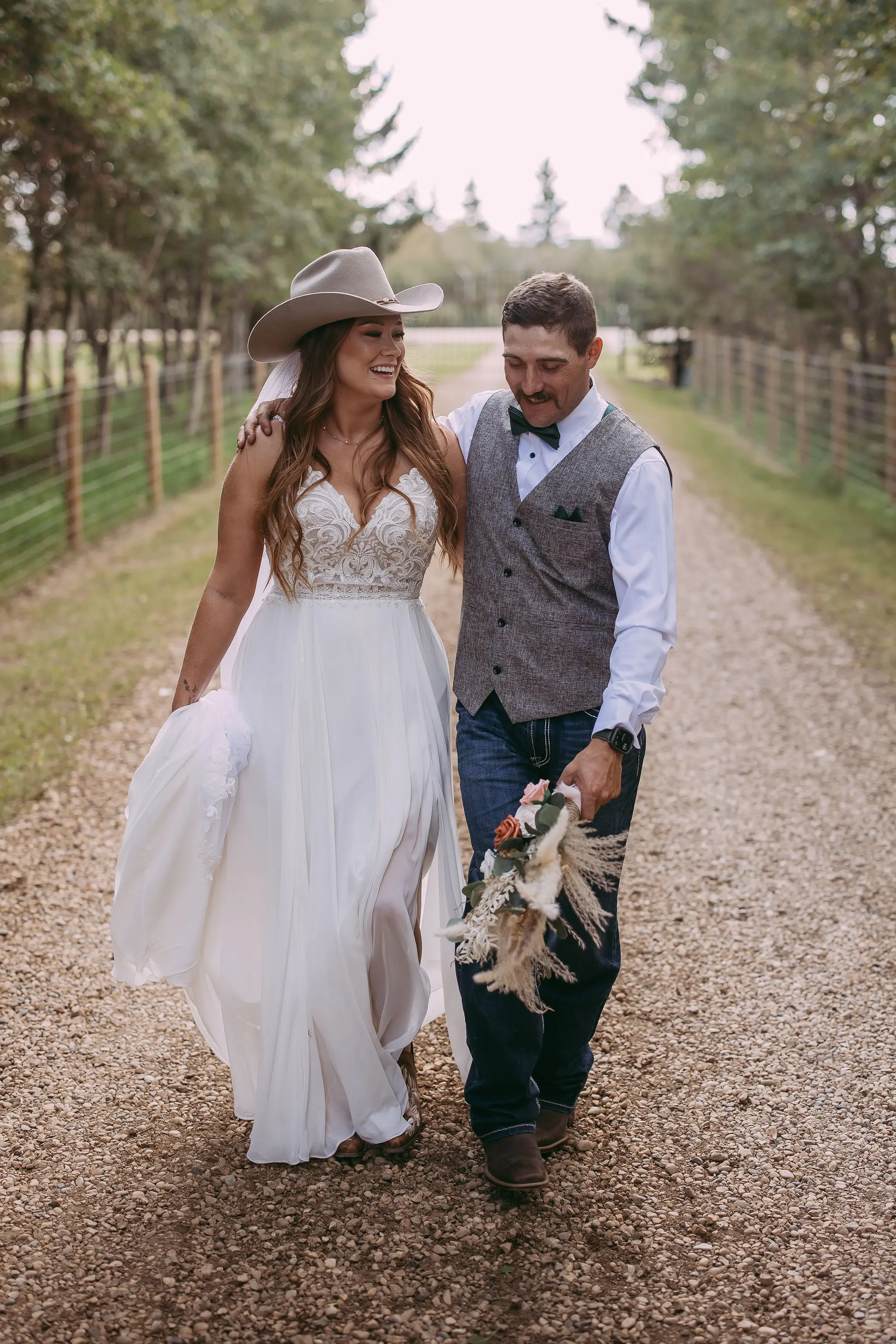 Groom With Bride Wearing Beaded Chiffon Sheath Wedding Dress Lorraine By Rebecca Ingram