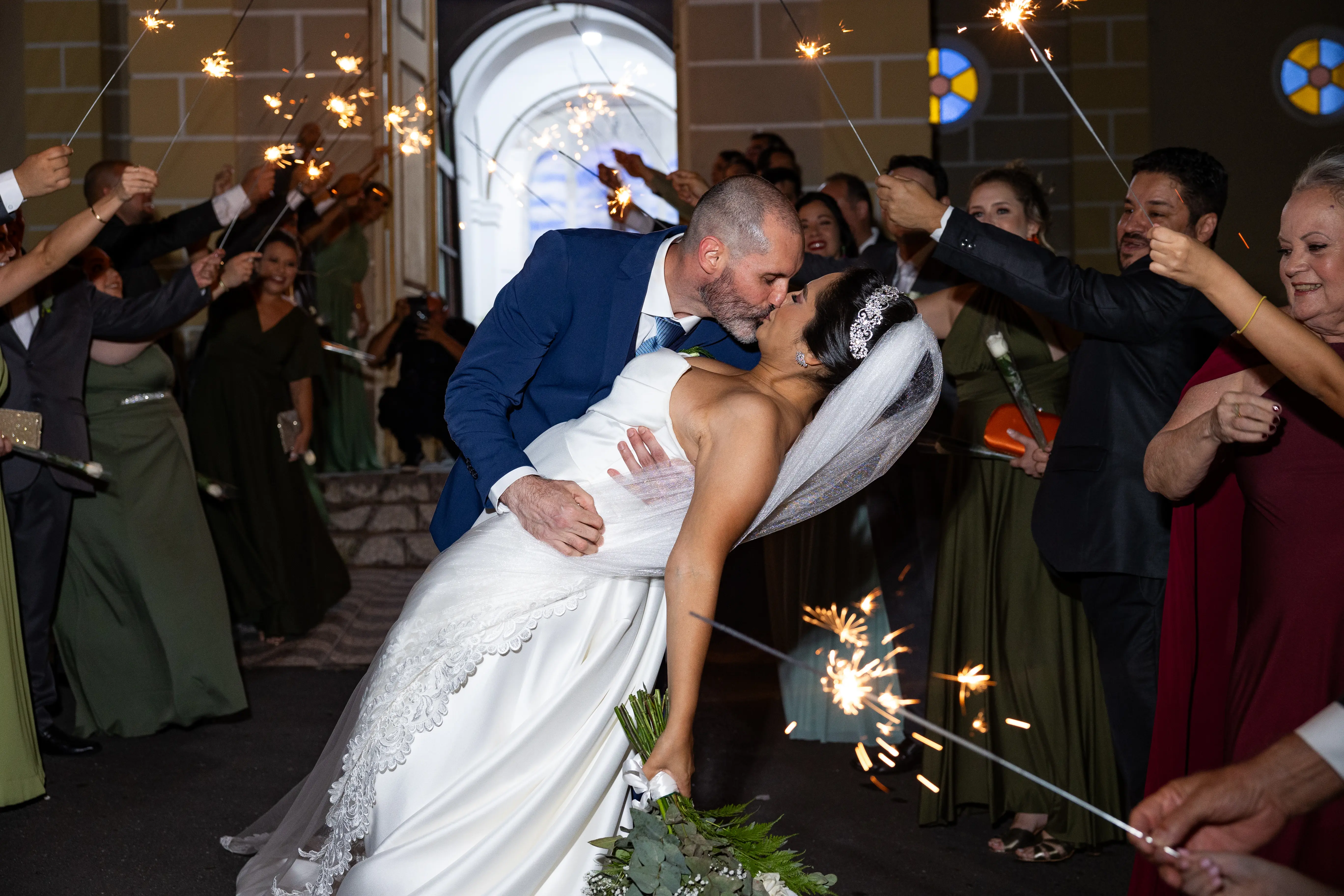 Bride wearing Aspen wedding dress by Sottero and Midgley being kissed by her husband