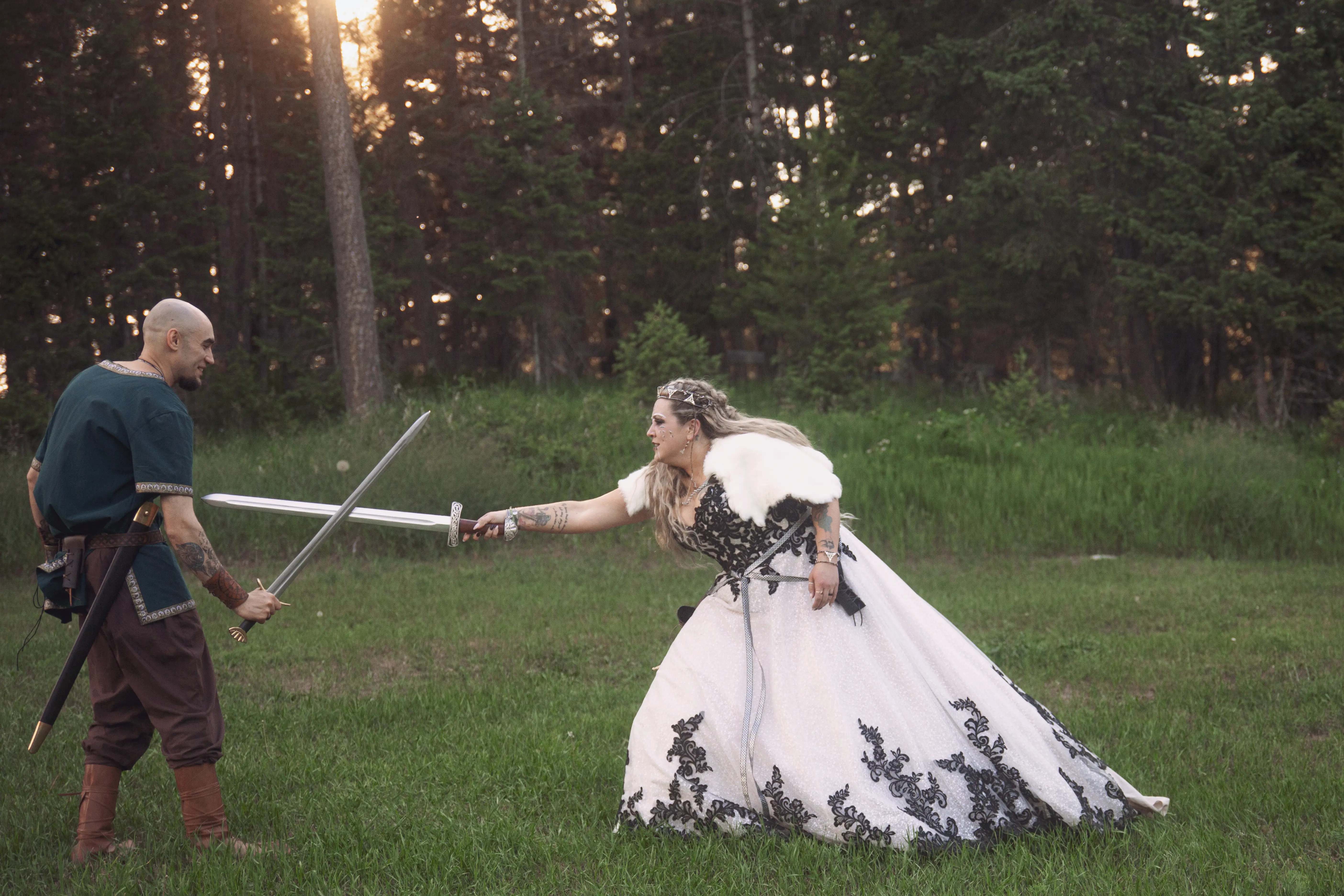 Bride wearing Trystin wedding dress by Maggie Sottero sword fighting her husband