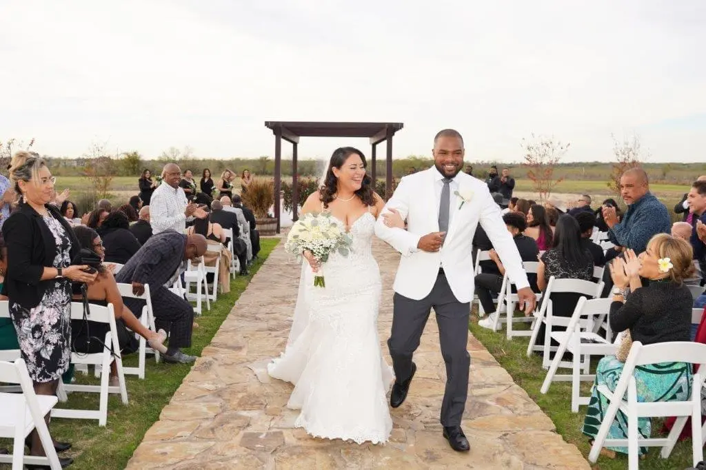 Bride wearing Fiona by Maggie Sottero with her husband