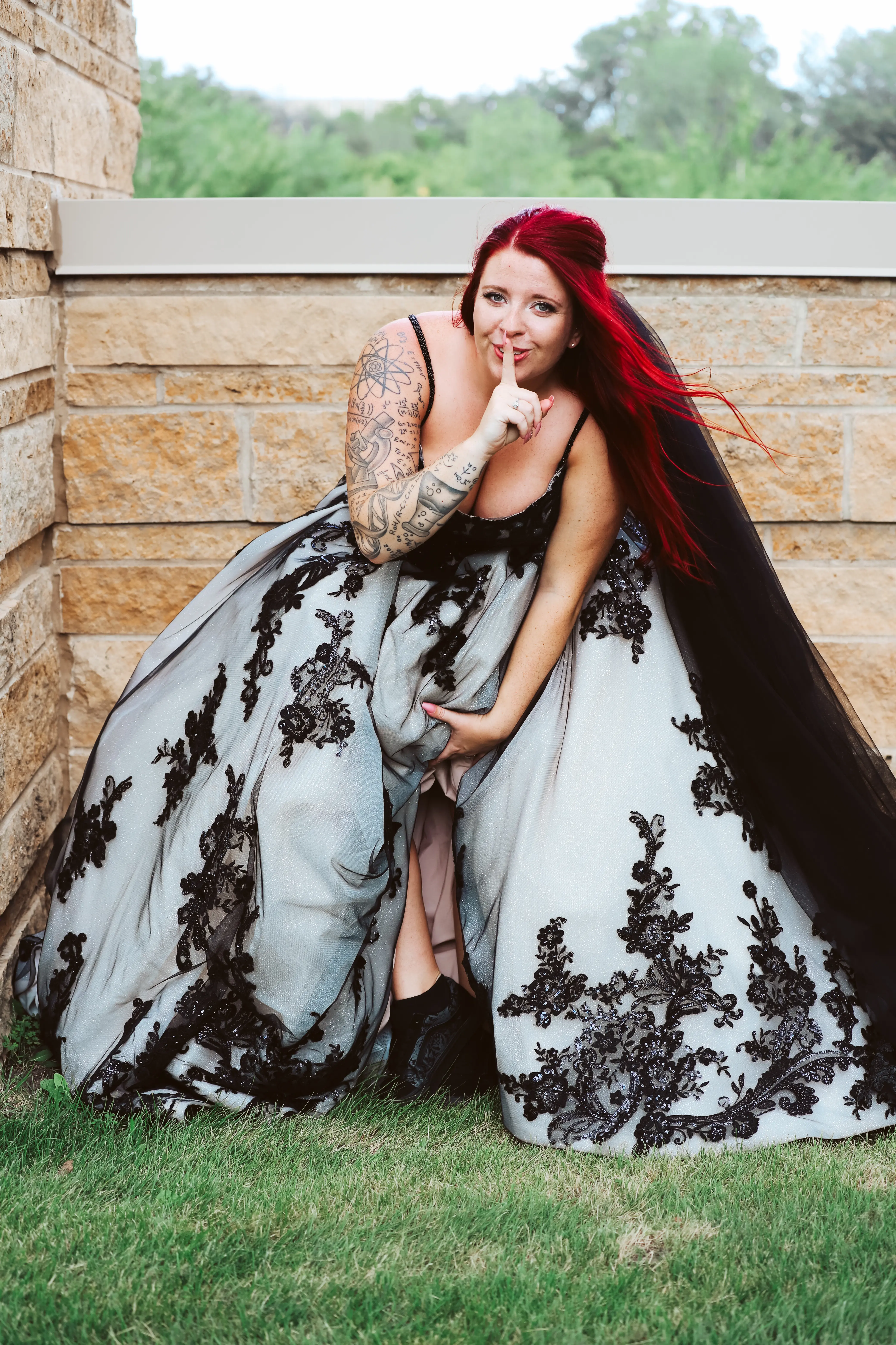 Bride Wearing Royal-Inspired Ball Gown Wedding Dress In Black Lace Called Norvinia By Sottero And Midgley