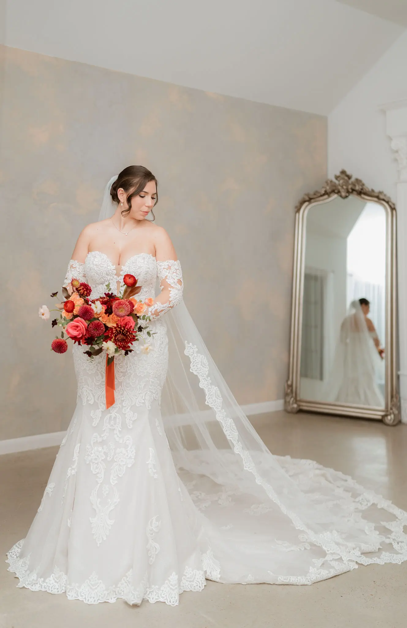 Bride wearing Fiona wedding dress by Maggie Sottero in front of a mirror