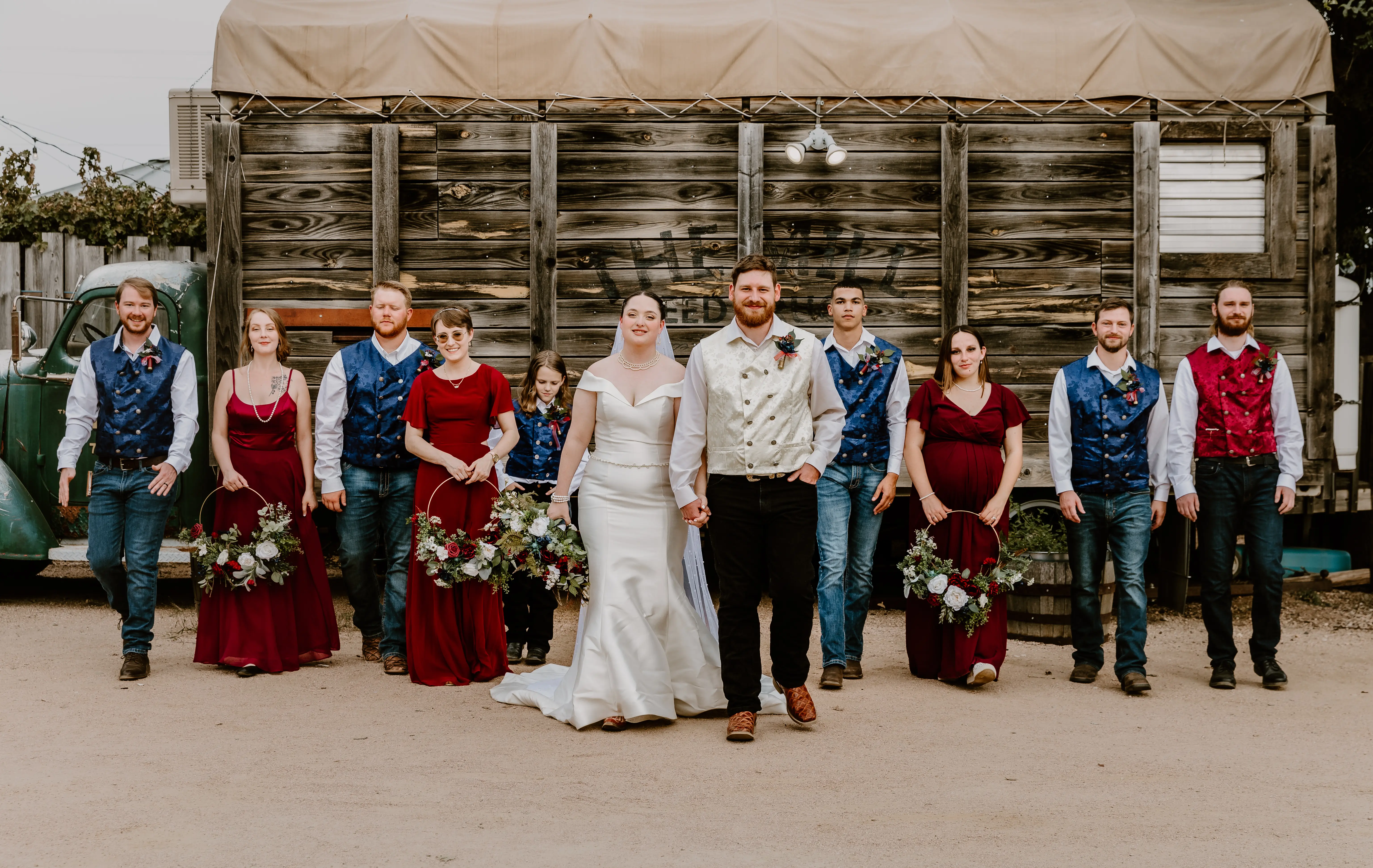 Bride Wearing Simple Fit And Flare Wedding Dress Called Josie By Rebecca Ingram With Bridal Party In Red White And Blue Attire