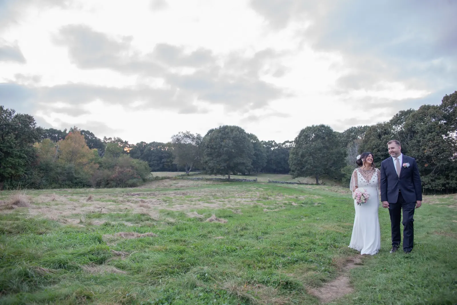 Groom and Bride Wearing Minimalist Crepe Fit-and-Flare Wedding Dress Called Fernanda by Maggie Sottero