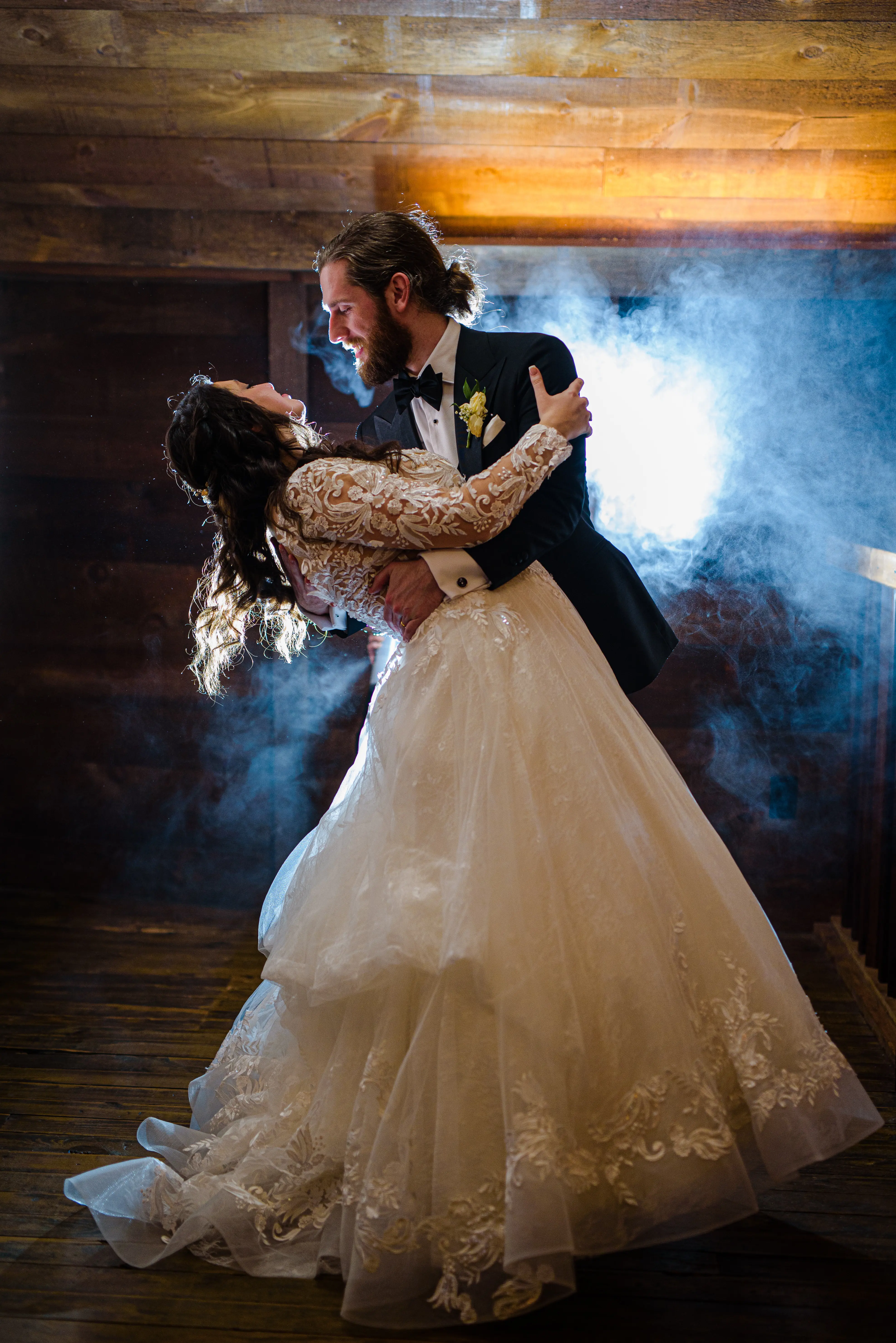 Bride And Groom Dancing Together. Bride Wearing Lace Long Sleeve Wedding Dress Called Zander By Sottero And Midgley