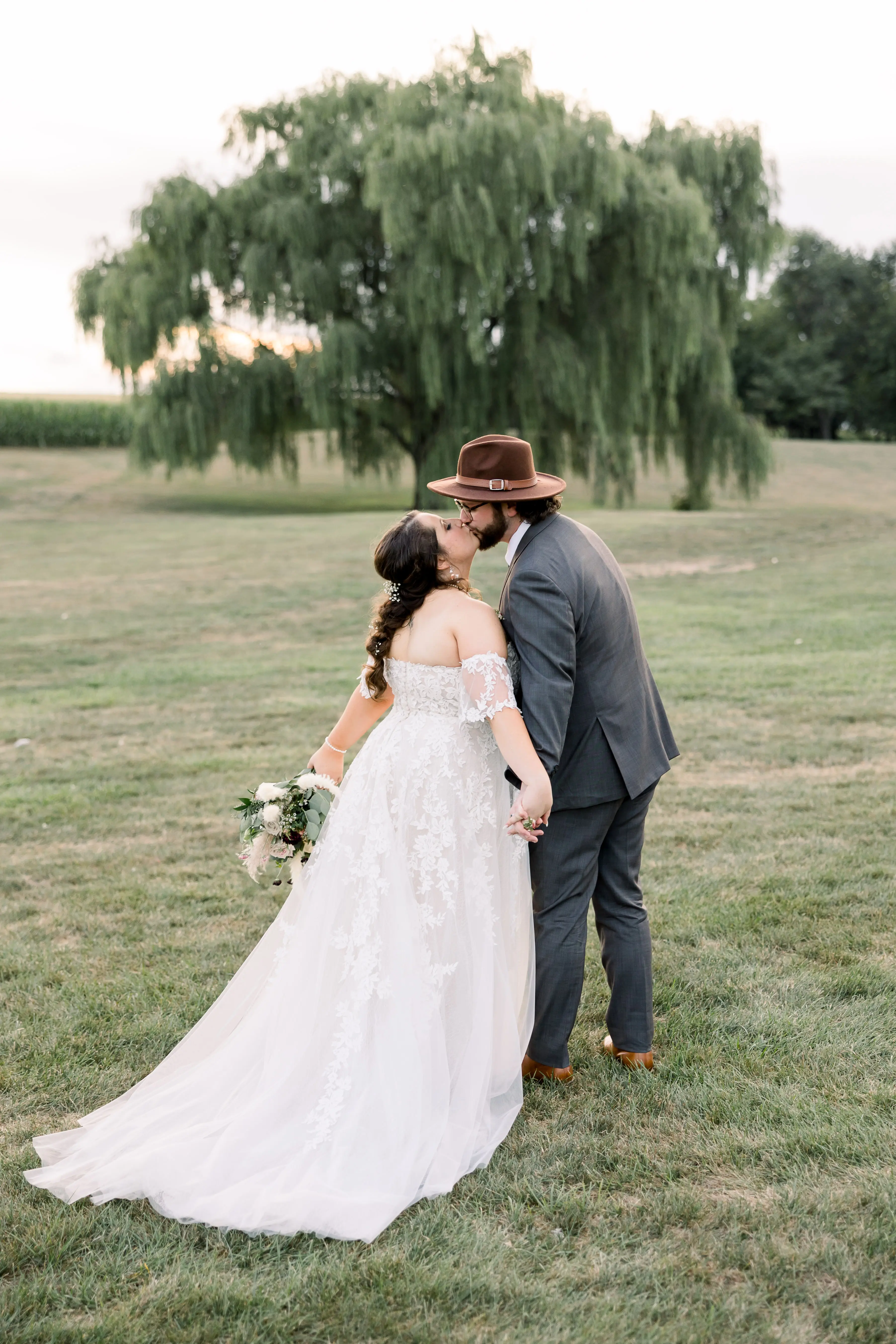 Plus Size Bride In Lace A-Line Wedding Dress Called Nora By Maggie Sottero With Groom