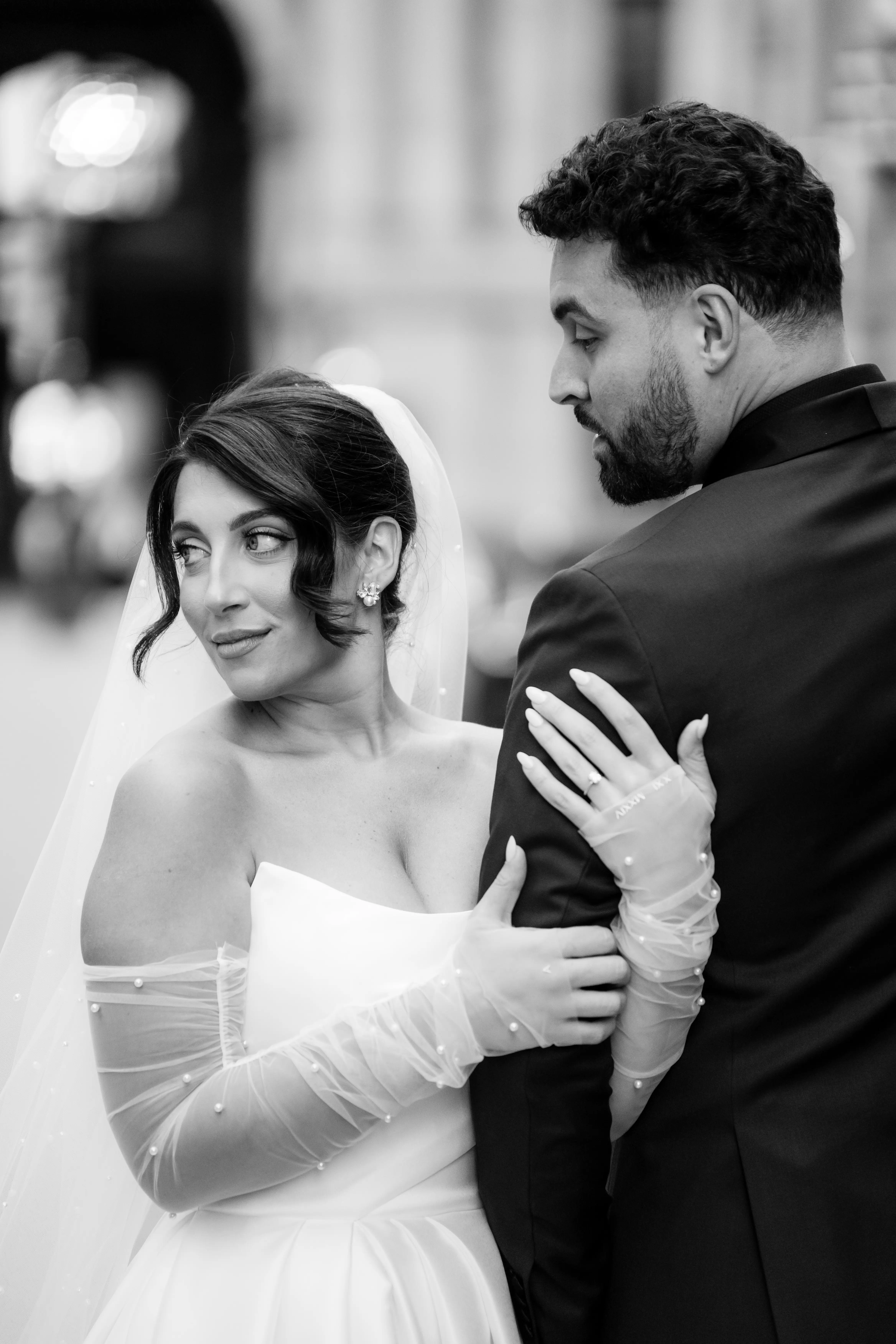 Bride Wearing Modern Ballgown Wedding Dress Called Aspen By Sottero And Midgley Holding Grooms Arm Looking Away