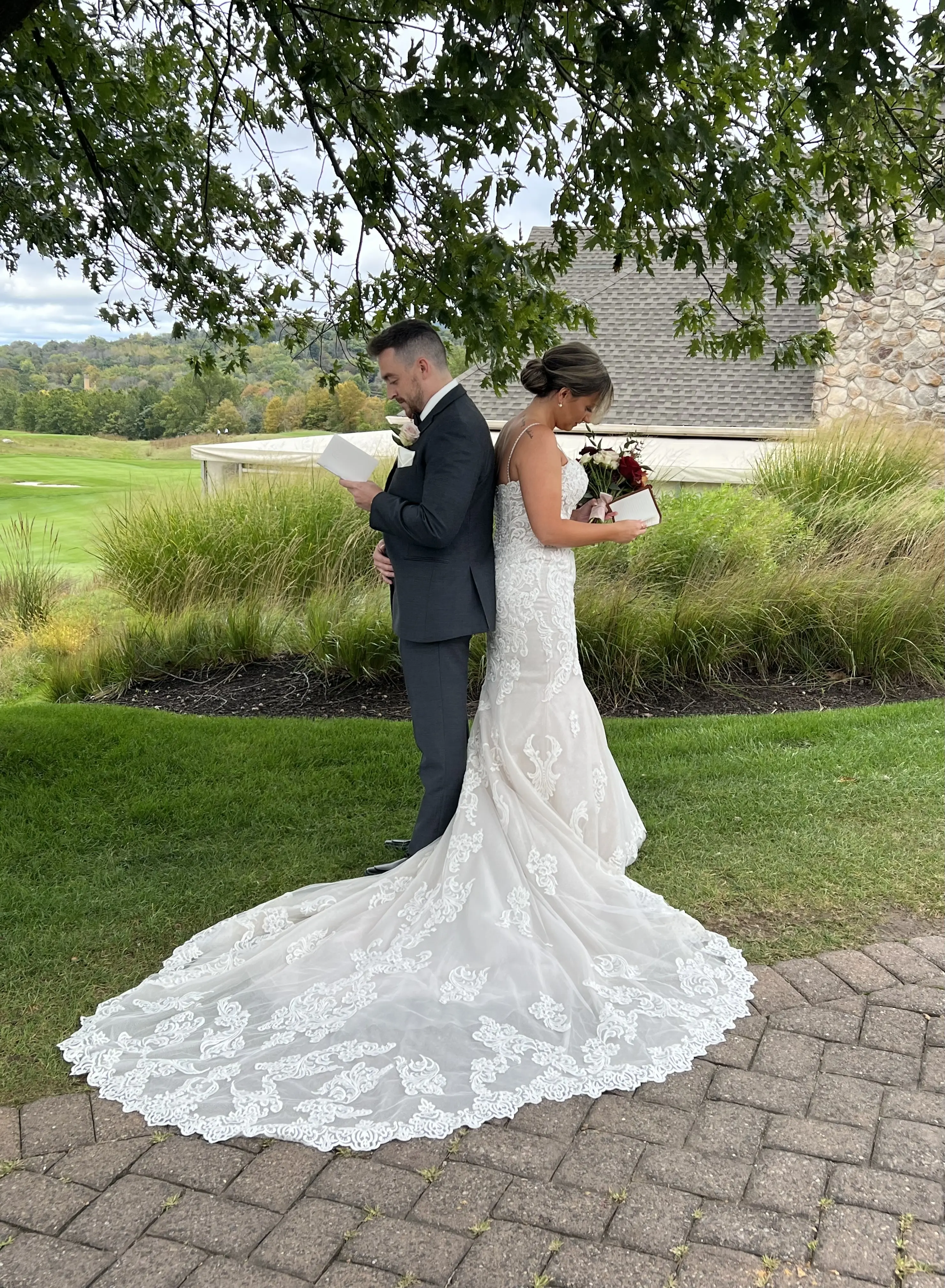 Bride wearing Fiona wedding gown by Maggie Sottero reading vows