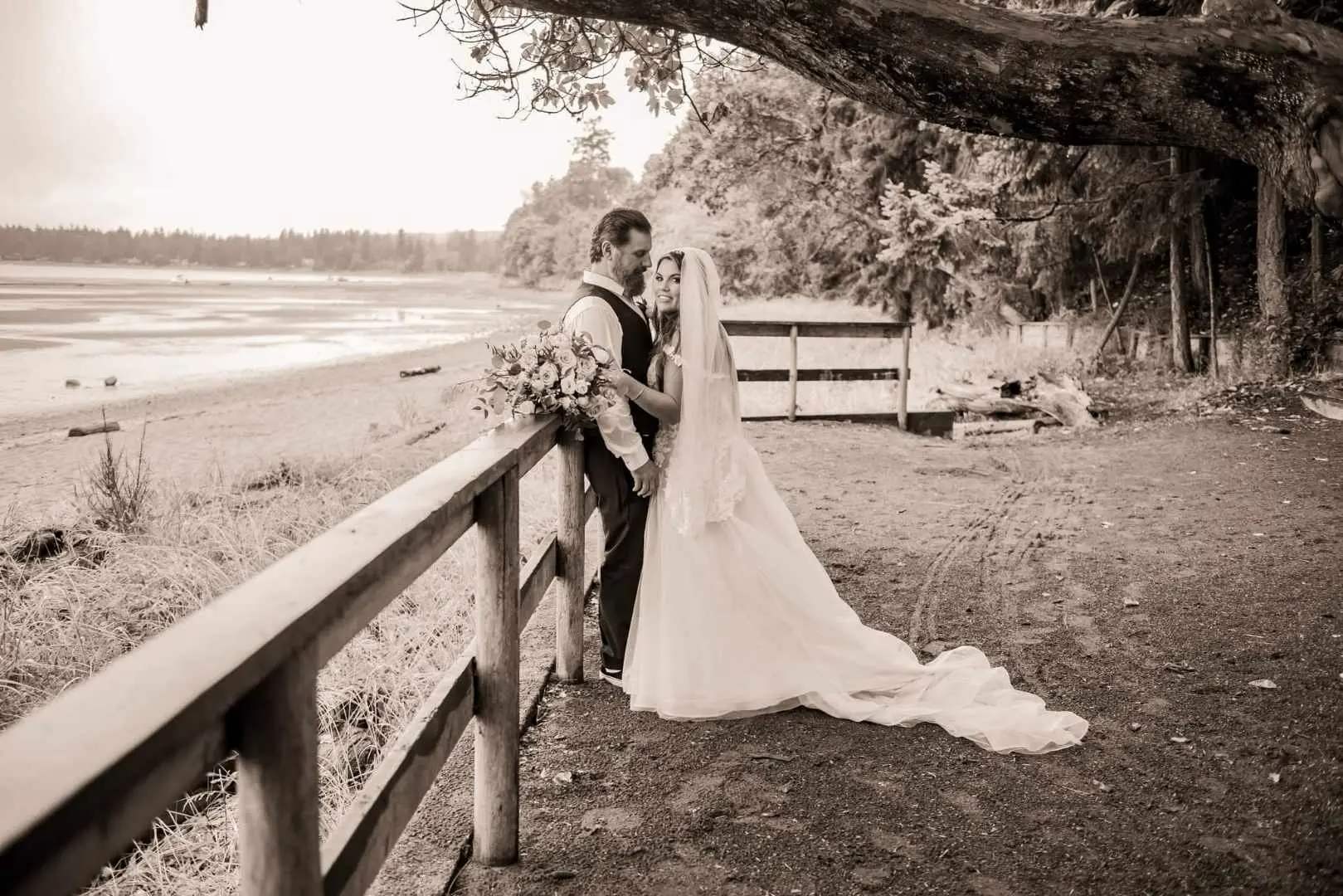 Bride wearing Boho Wedding Dress called Stevie by Maggie Sottero on a lakefront with her groom