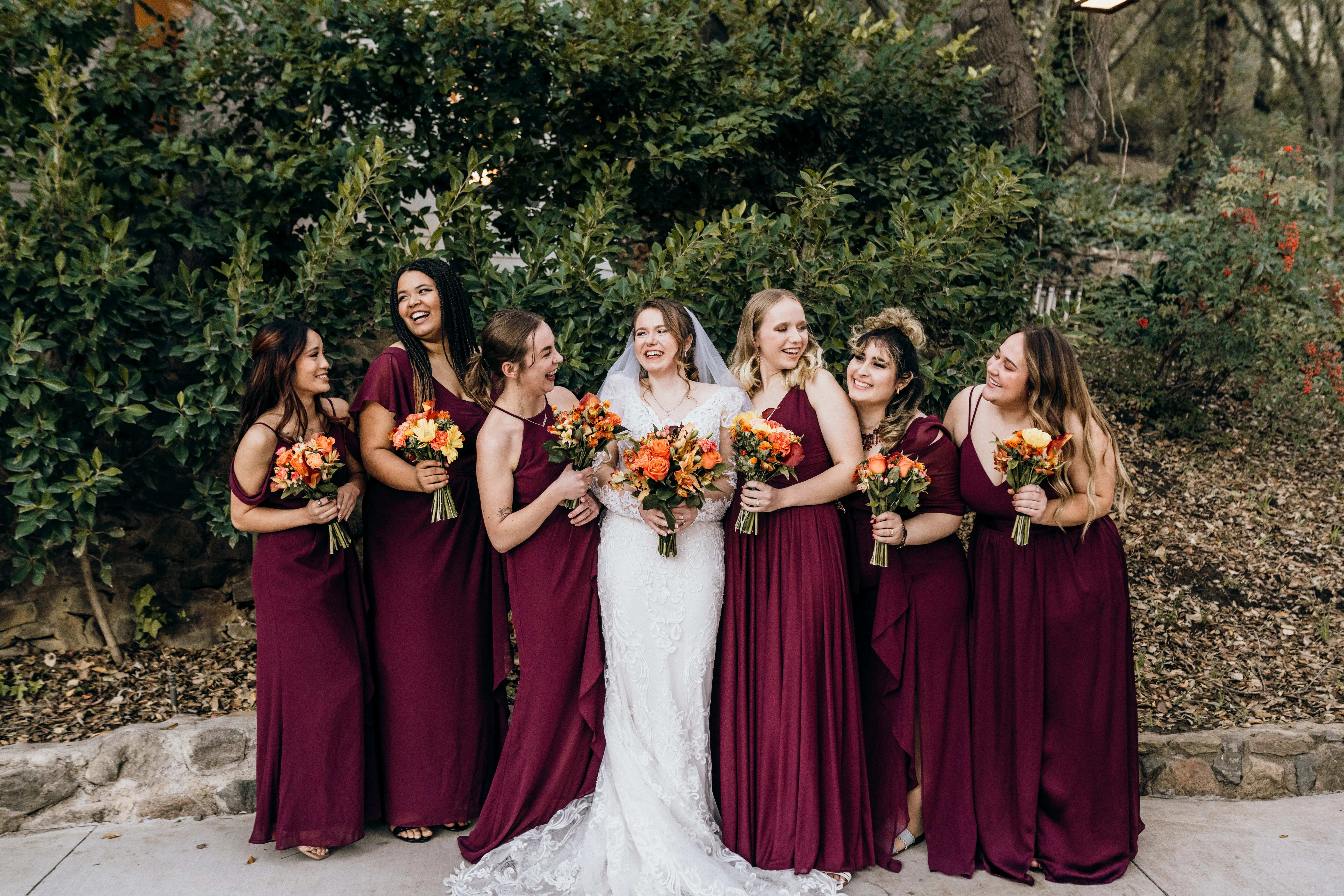 Bride In Embroidered Lace Sheath Dress Hamilton Sottero Midgley With Bridesmaids in Wine