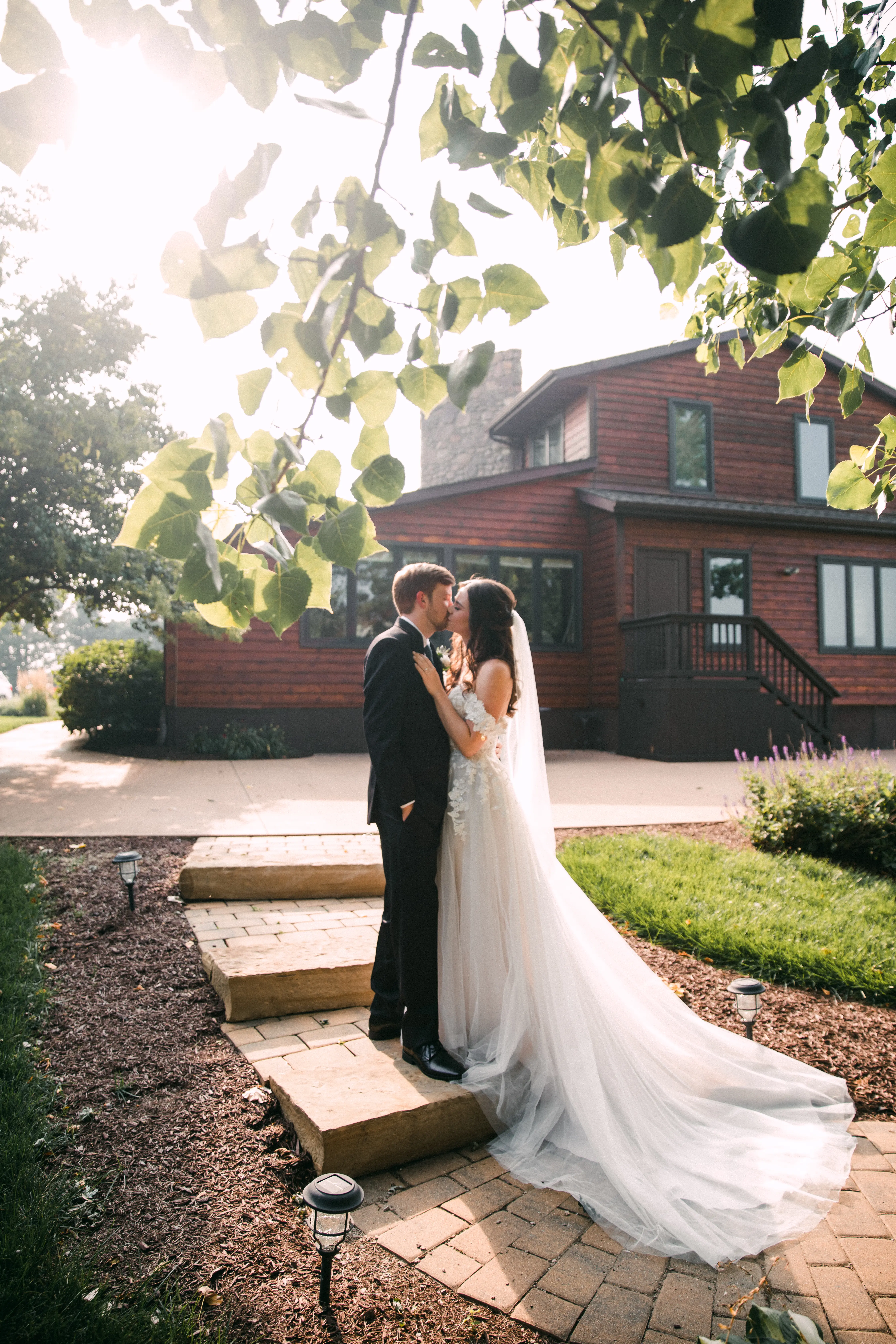 Groom With Bride Wearing A-Line Lace Wedding Dress With Customized Off The Shoulder Sleeves Stevie By Maggie Sottero