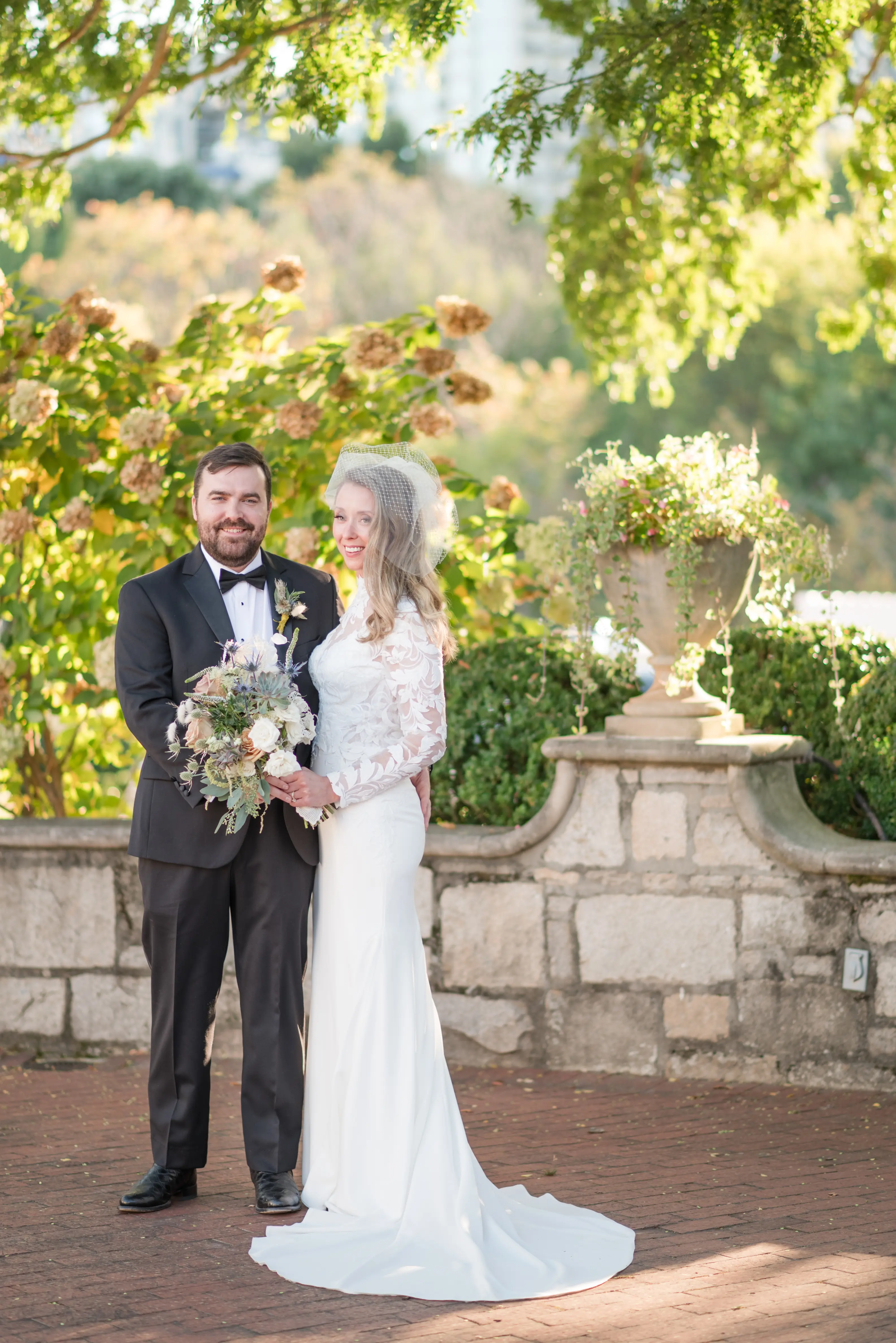 Bride wearing Dionne wedding dress by Rebecca Ingram with her husband
