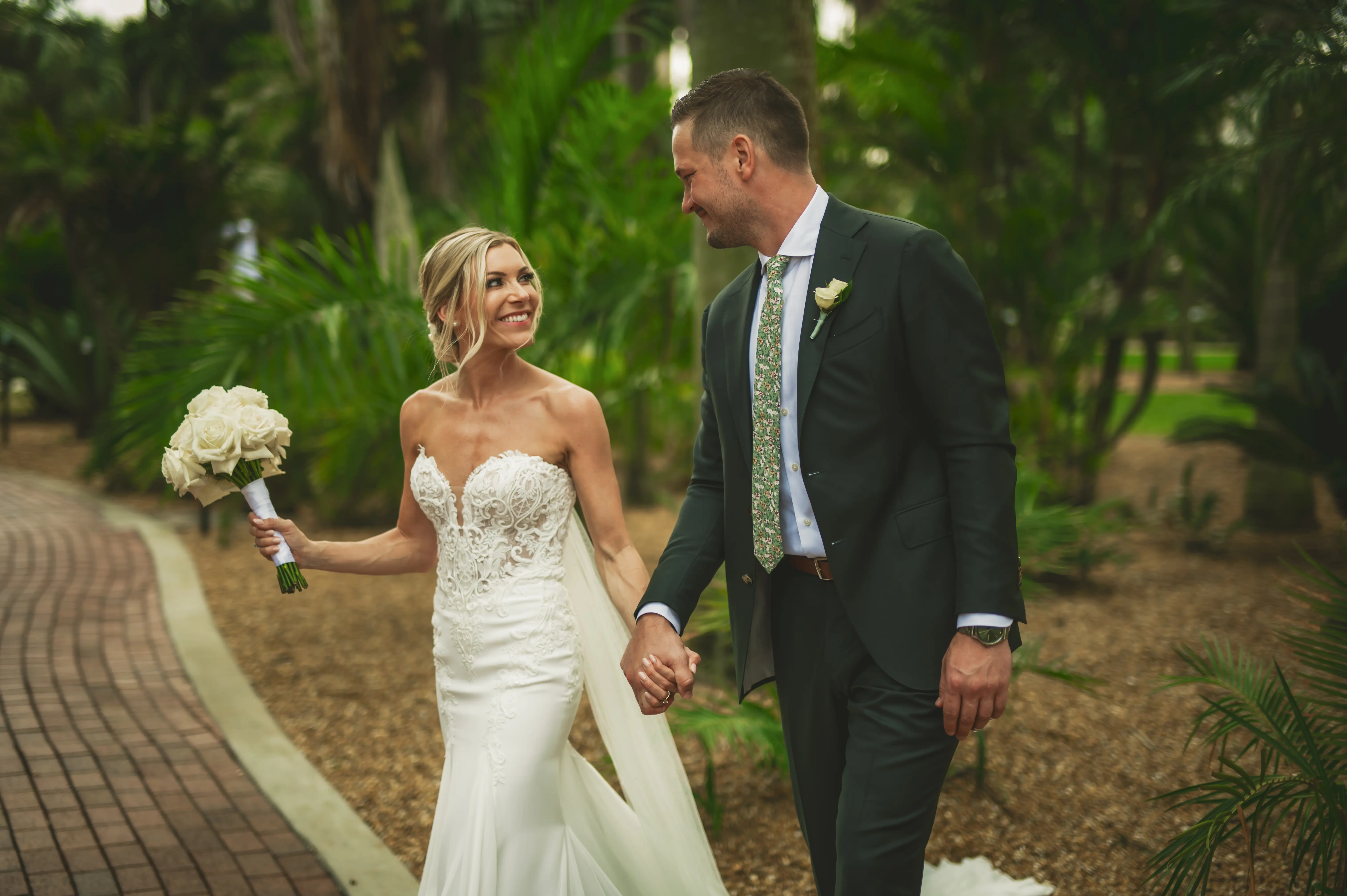 Real Bride in Fit-and-Flare Strapless Chiffon Wedding Gown with Sequined Lace Motifs over Chantilly Lace with Corset Detailing Called Giovannetta by Sottero & Midgley