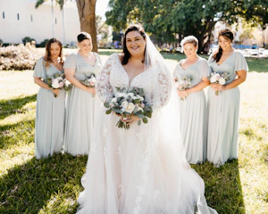 Bride Wearing Illusion Sleeve A-Line Wedding Dress Raphael By Maggie Sottero