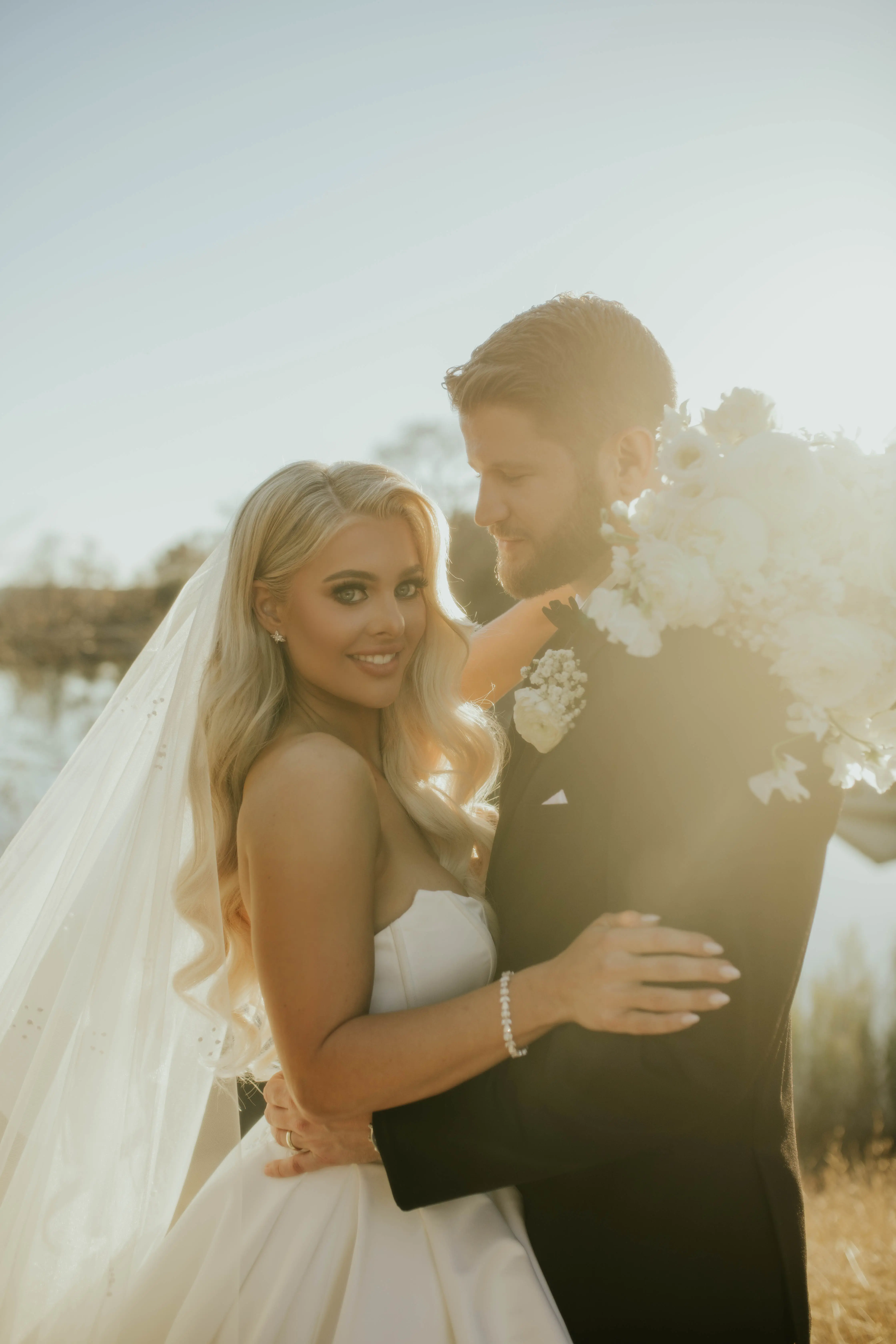 Bride wearing Derrick by Maggie Sottero with her husband