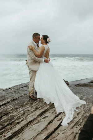 Bride with groom wearing boho wedding dress with keyhole back.