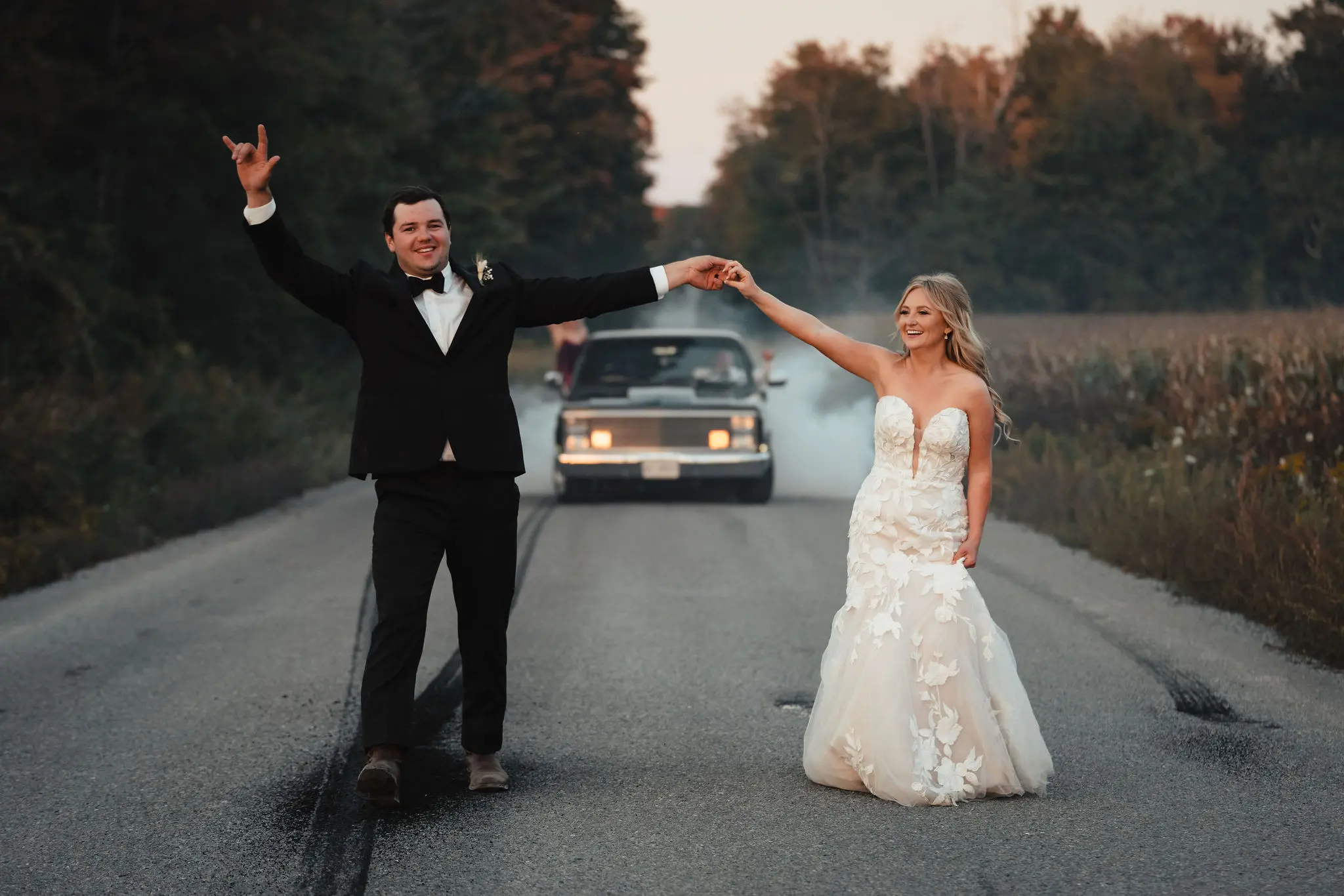 Bride in strapless sweetheart neckline wedding dress called Hattie by Rebecca Ingram with groom
