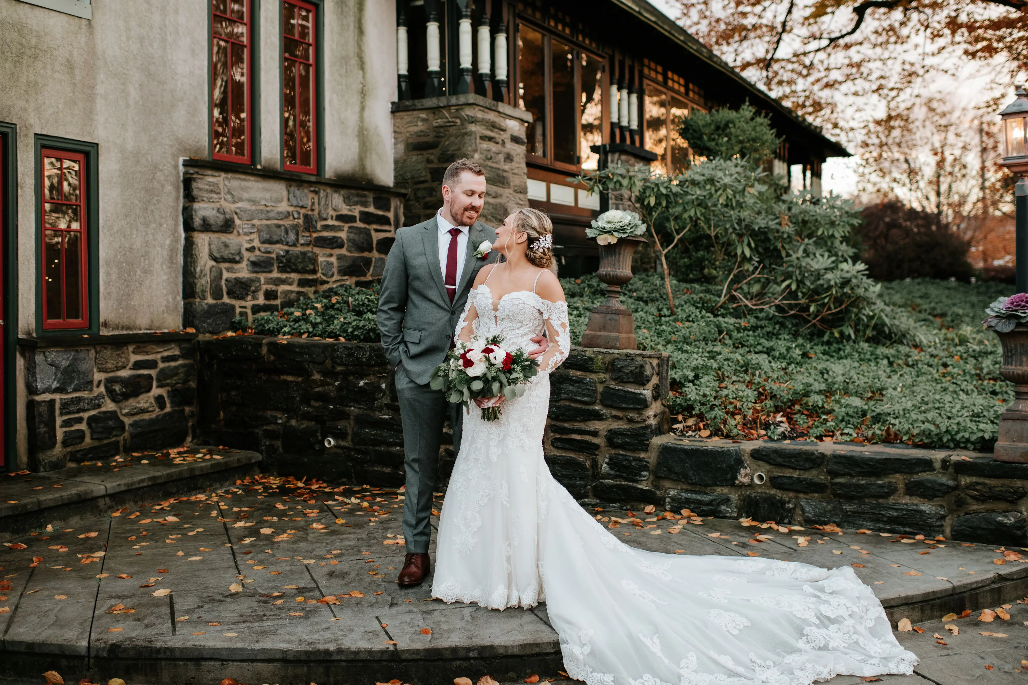 Groom with Bride in Sparkly Lace Fit-and-Flare Bridal Dress with Off-the-Shoulder Sleeves Called Fiona by Maggie Sottero