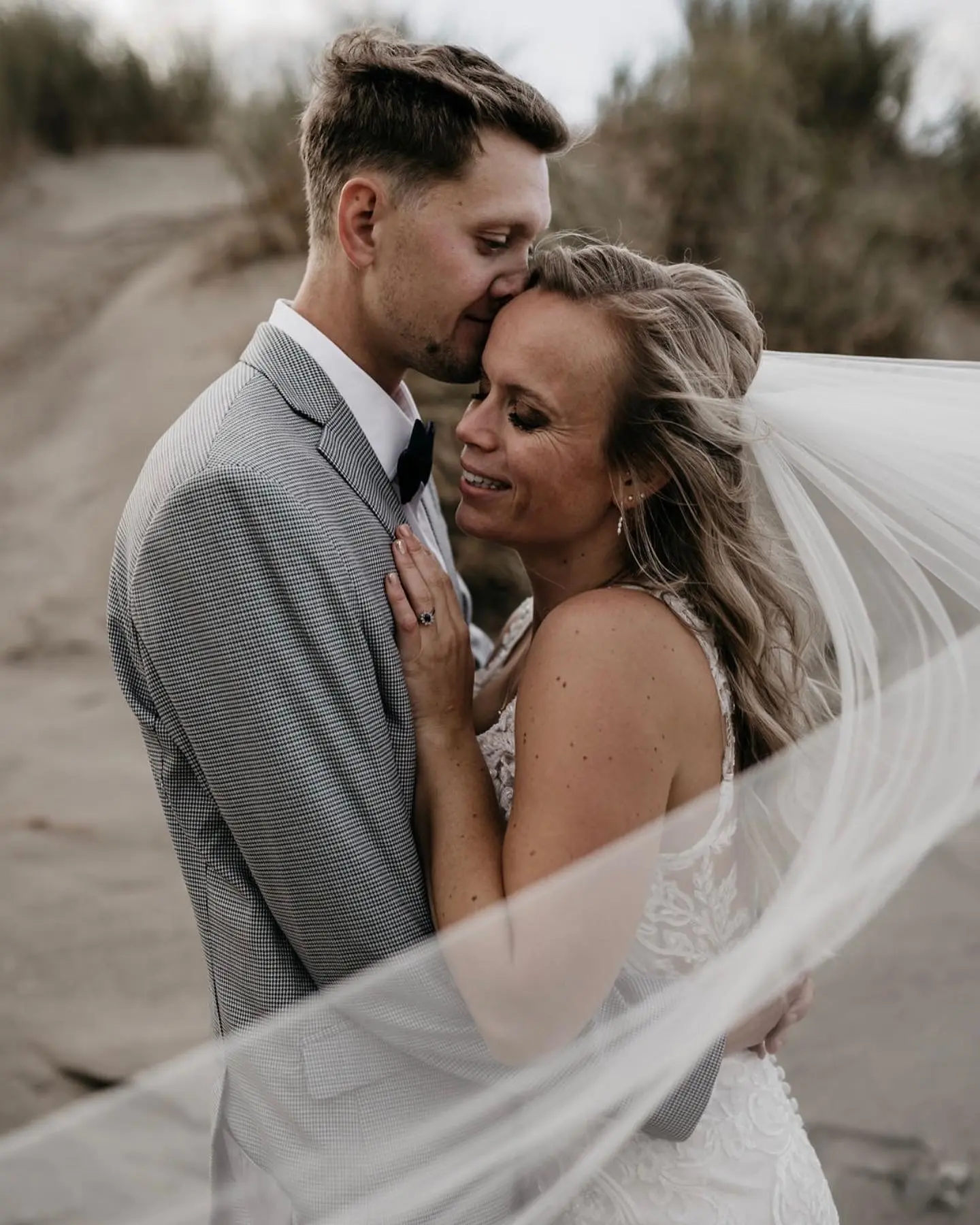 Bride Wearing Illusion Lace Back Wedding Dress Called Hamilton By Sottero And Midgley Snuggling Into Groom