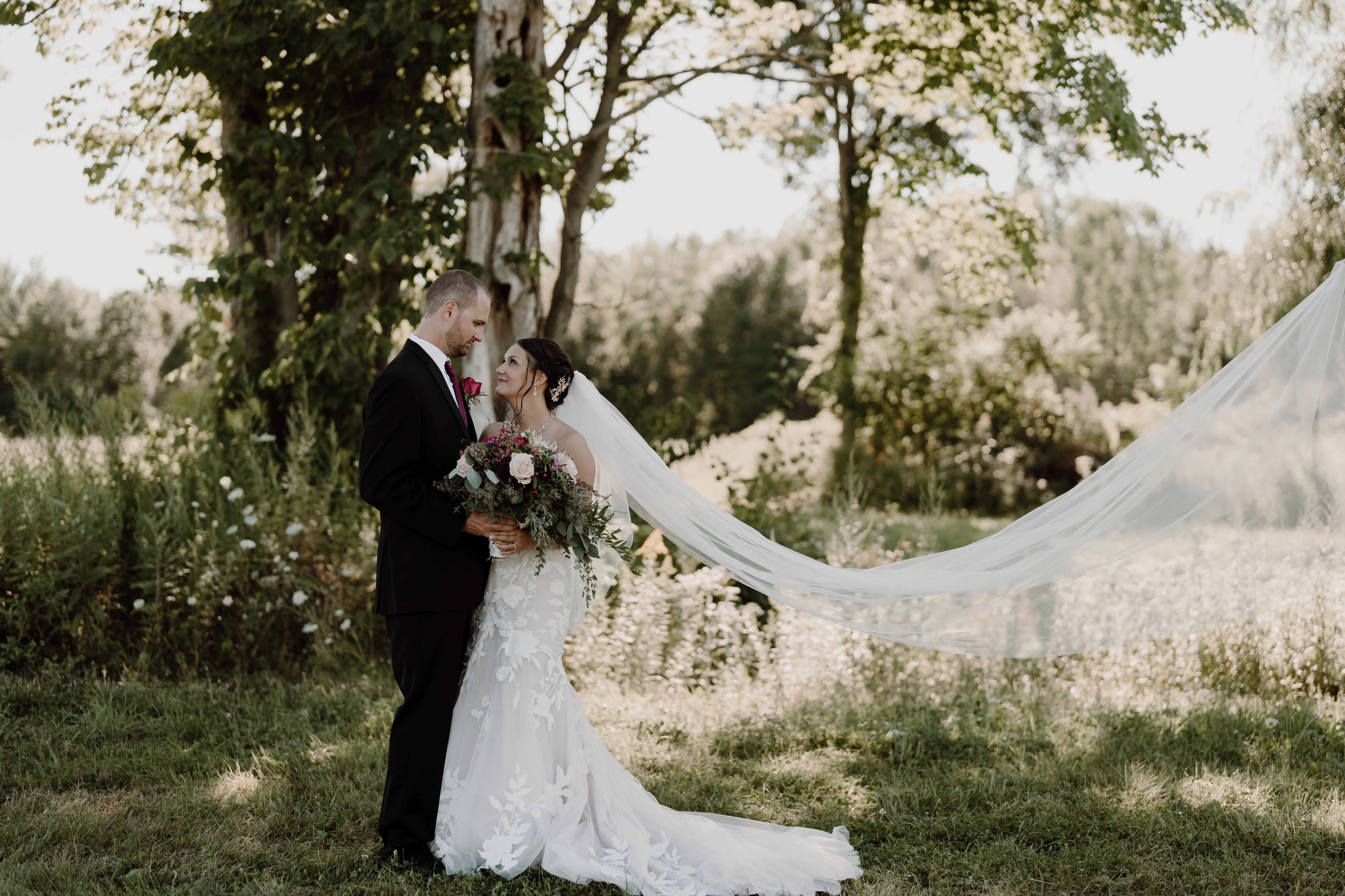 Groom With Bride Wearing Mermaid Wedding Dress With Oversized Lace Hattie By Rebecca Ingram