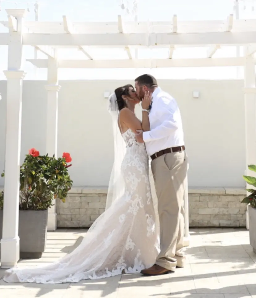 Groom With Bride Wearing Lace Sheath Wedding Dress Tuscany Lynette By Maggie Sottero