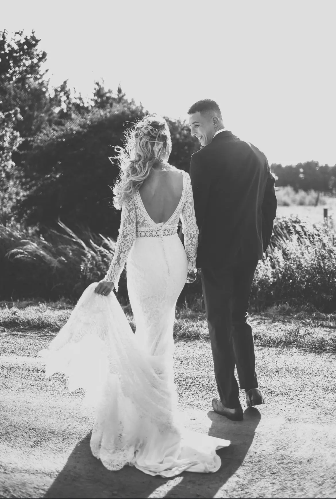 Real Bride in Allover Lace V-back Wedding Dress Named Drita by Maggie Sottero with Broom