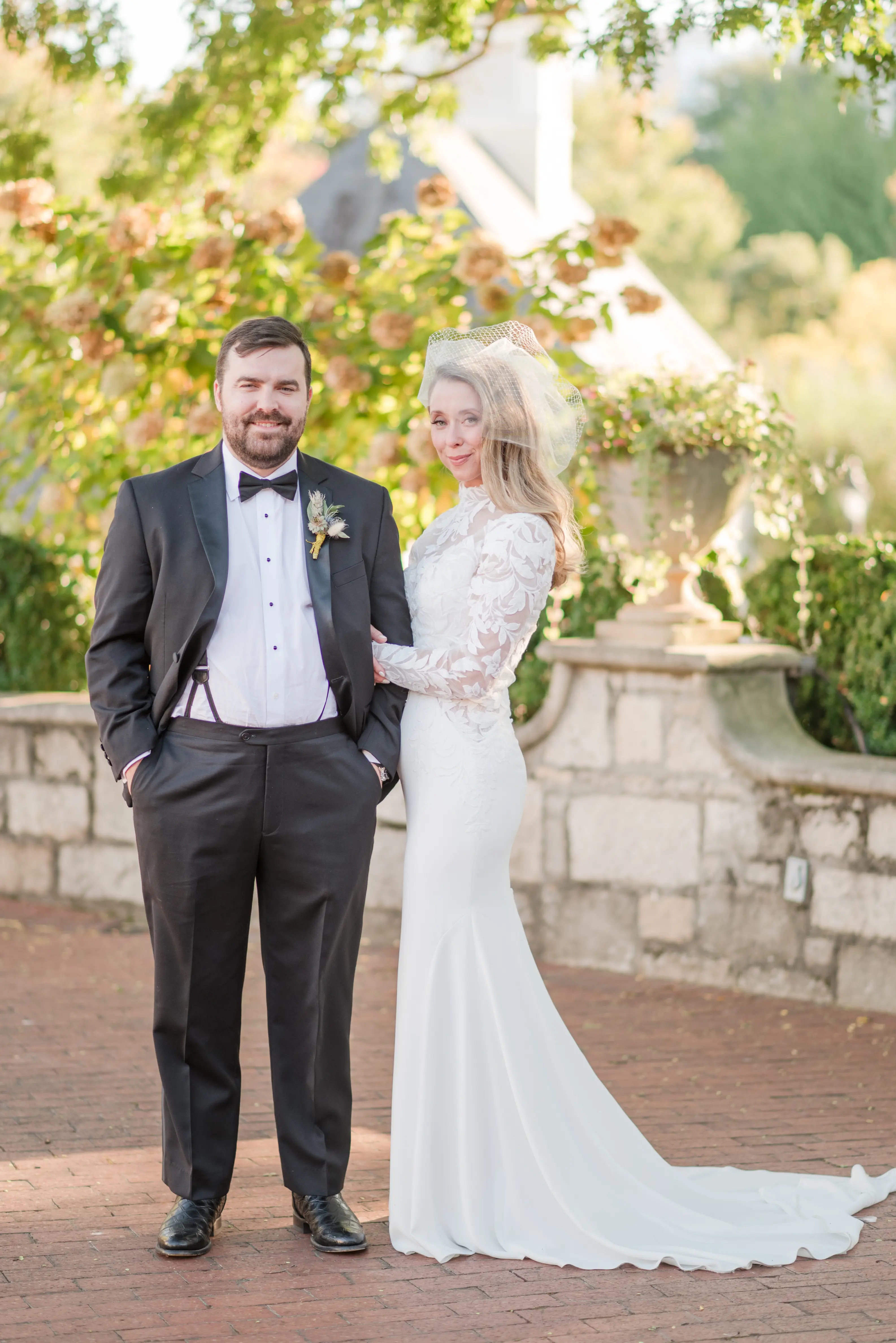 Bride wearing Dionne wedding dress by Rebecca Ingram with her husband