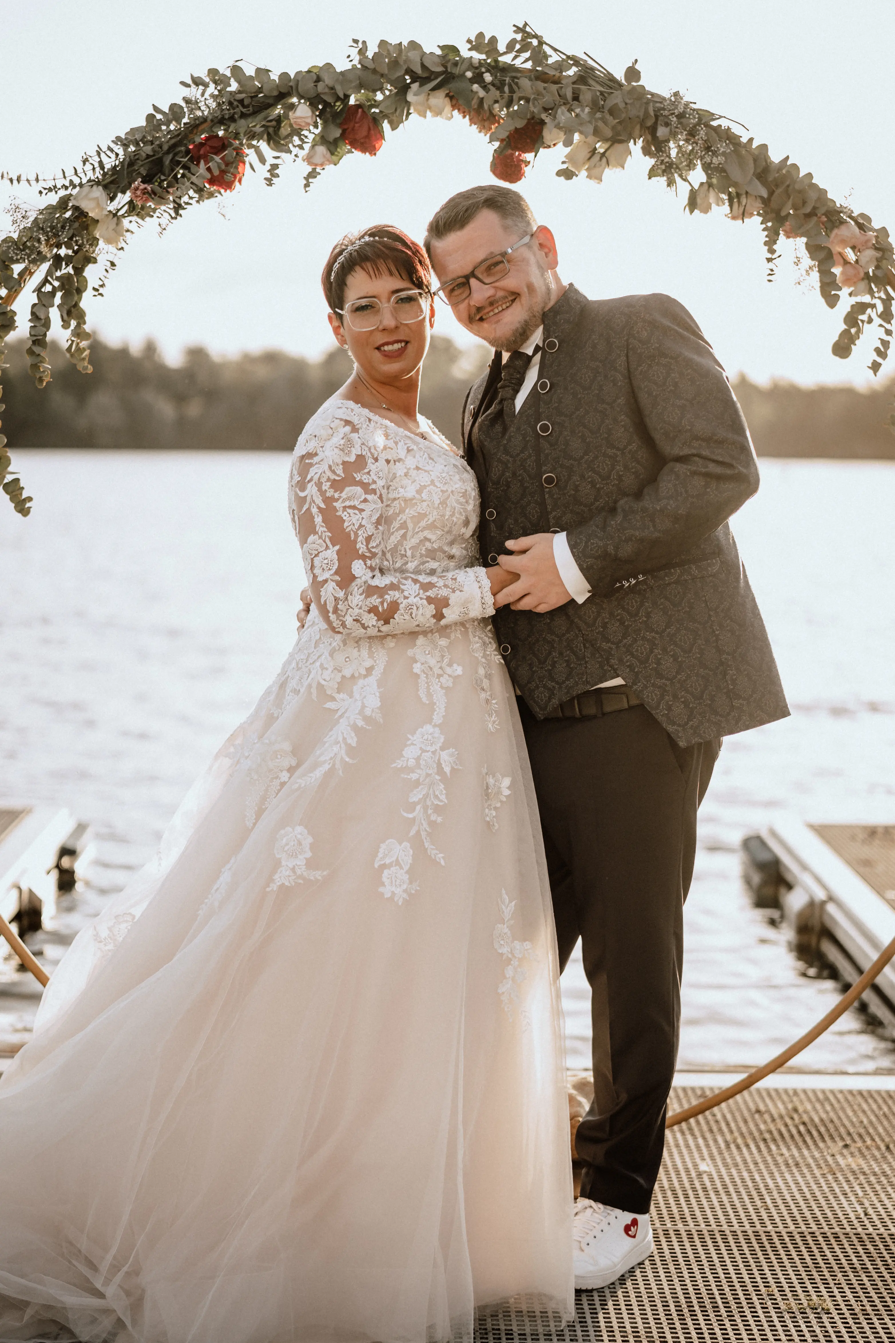 Bride in Long Sleeve Ivory Wedding Dress Raphael with Groom