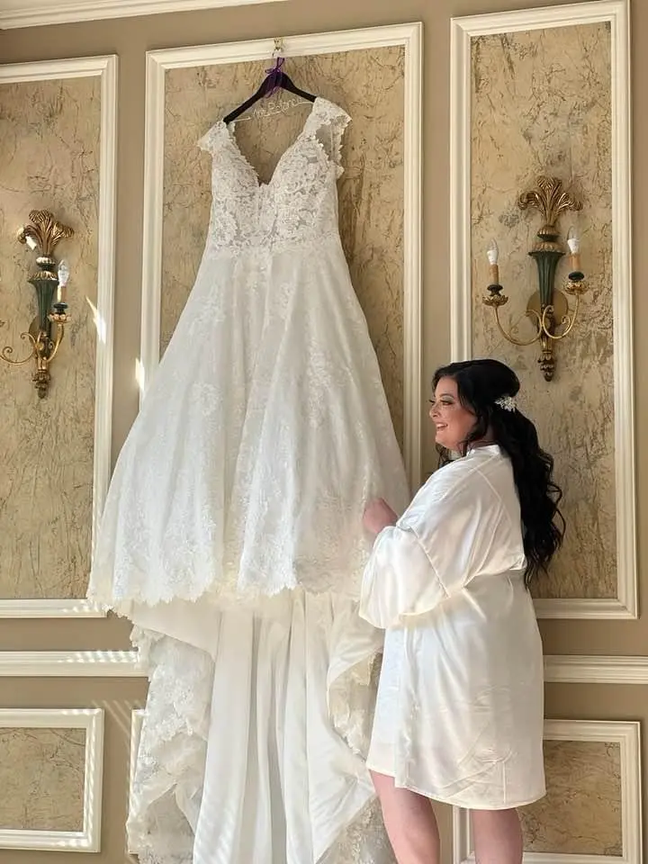Bride Holding Lace Ballgown Wedding Dress Called Kiernan By Sottero And Midgley