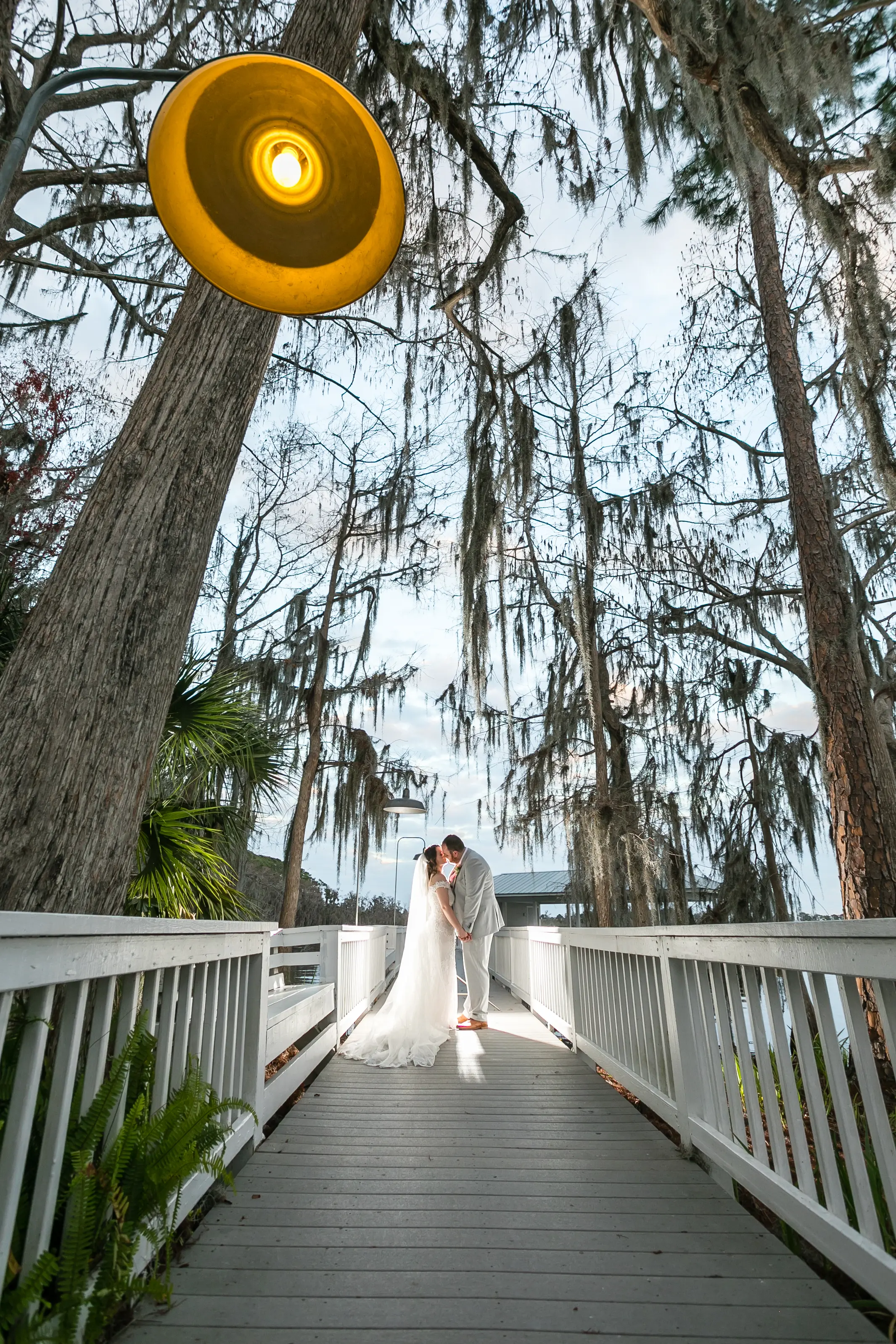 Bride In Off The Shoulder Lace Wedding Dress Called Edison By Maggie Sottero With Groom