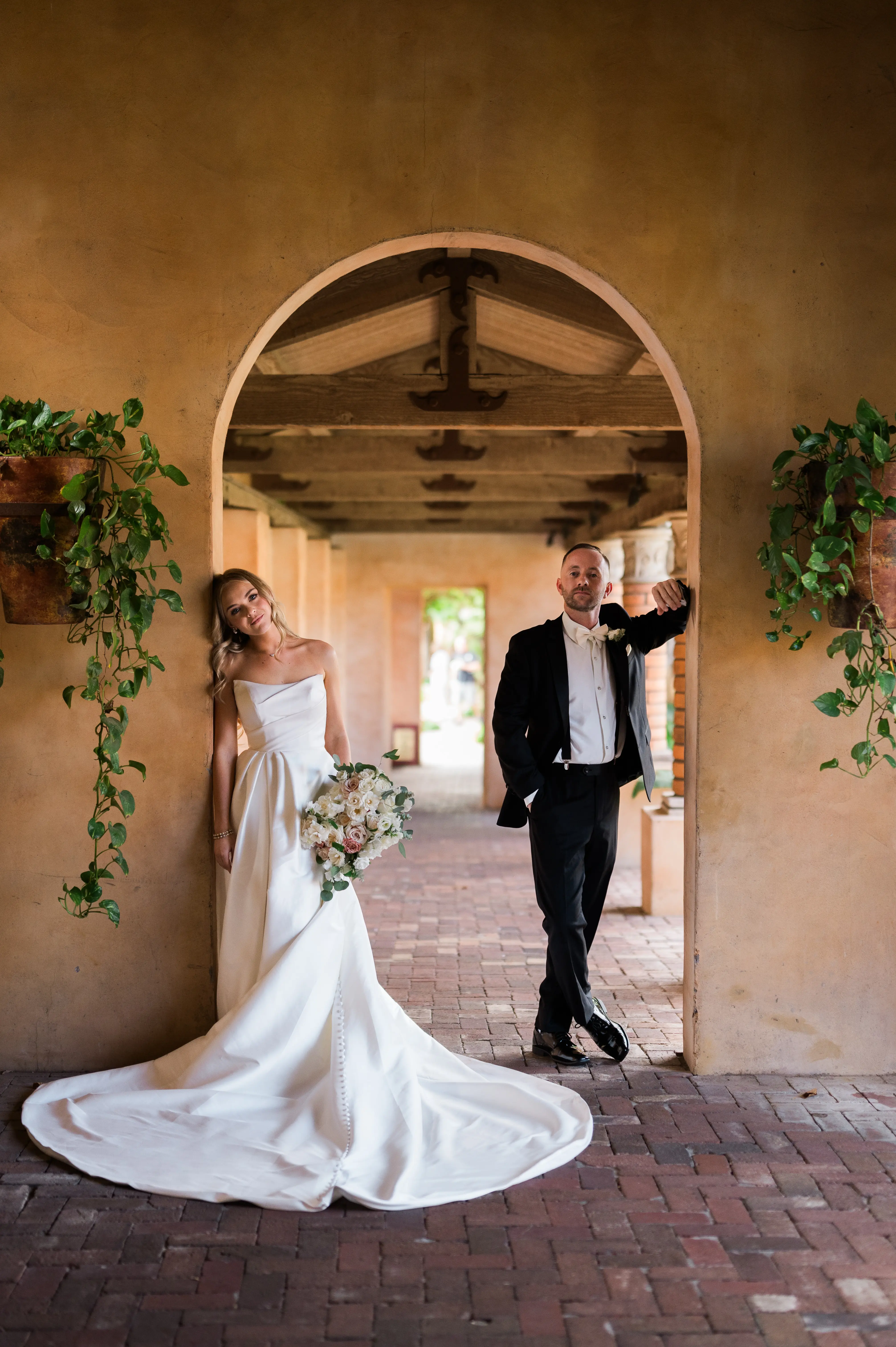 Bride wearing Aspen wedding dress by Sottero and Midgley with groom