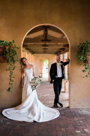 Bride wearing Aspen wedding dress by Sottero and Midgley with groom