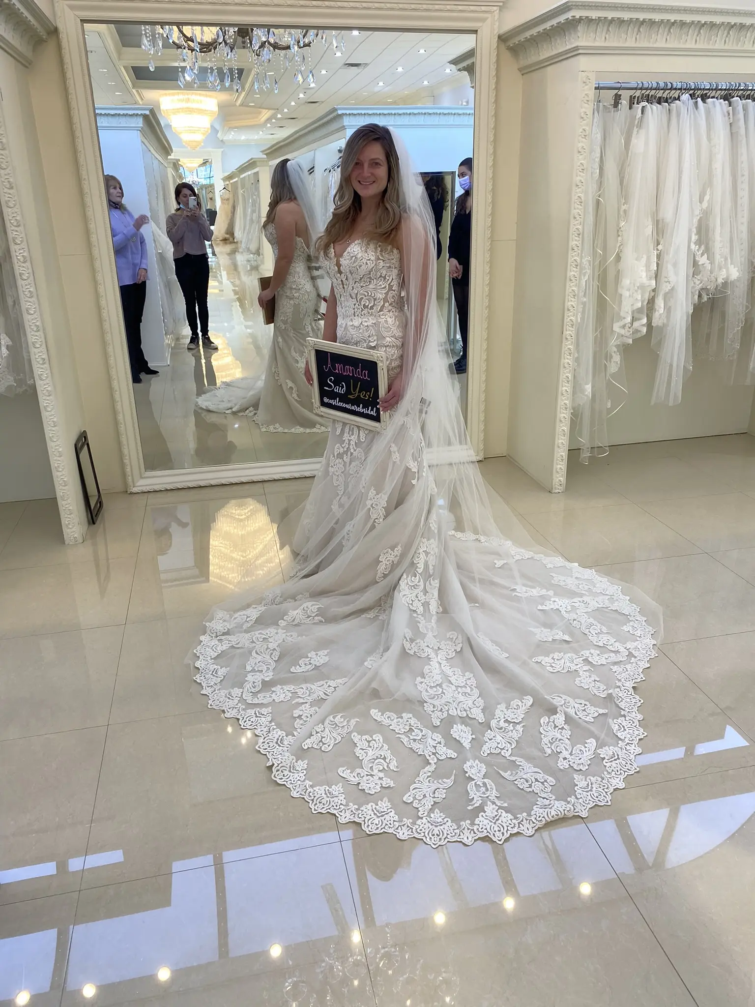 Bride in Retail Store In Sparkly Lace Fit-And-Flare Bridal Dress Called Fiona By Maggie Sottero