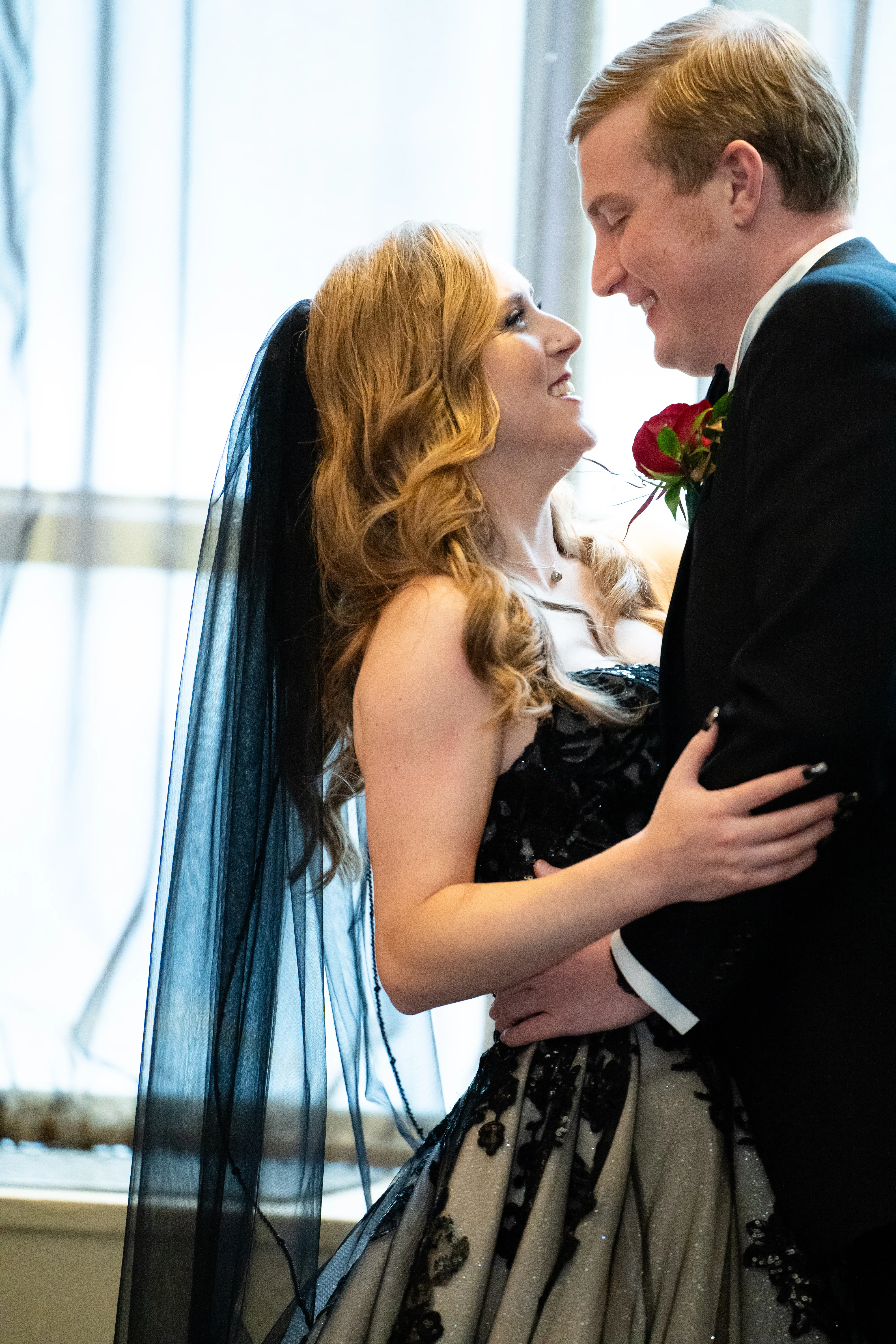 Bride wearing Norvinia wedding dress by Sottero and Midgley with her husband