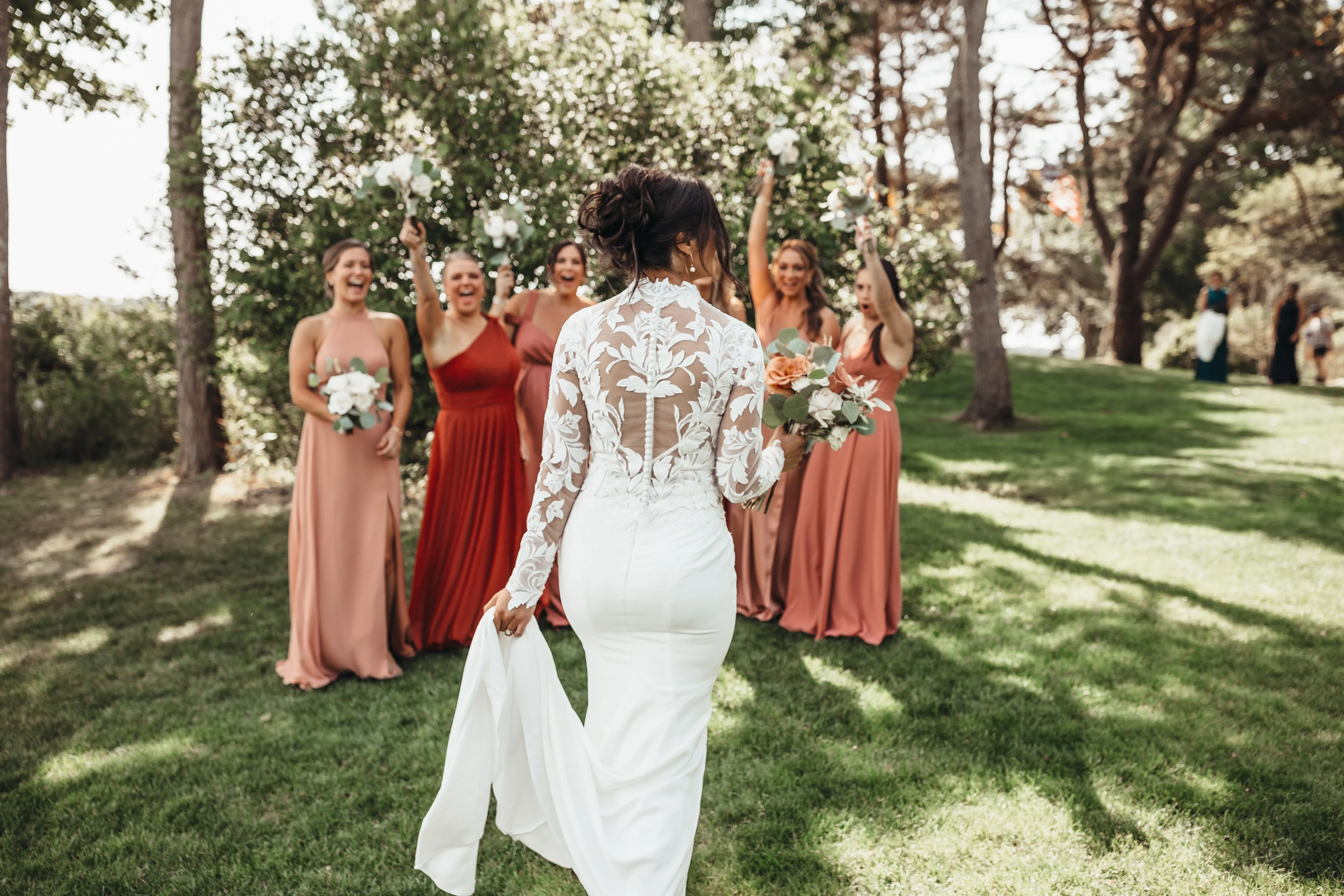 Bride Wearing Crepe And Lace Bridal Dress Called Dionne By Rebecca Ingram First Look With Bridesmaids