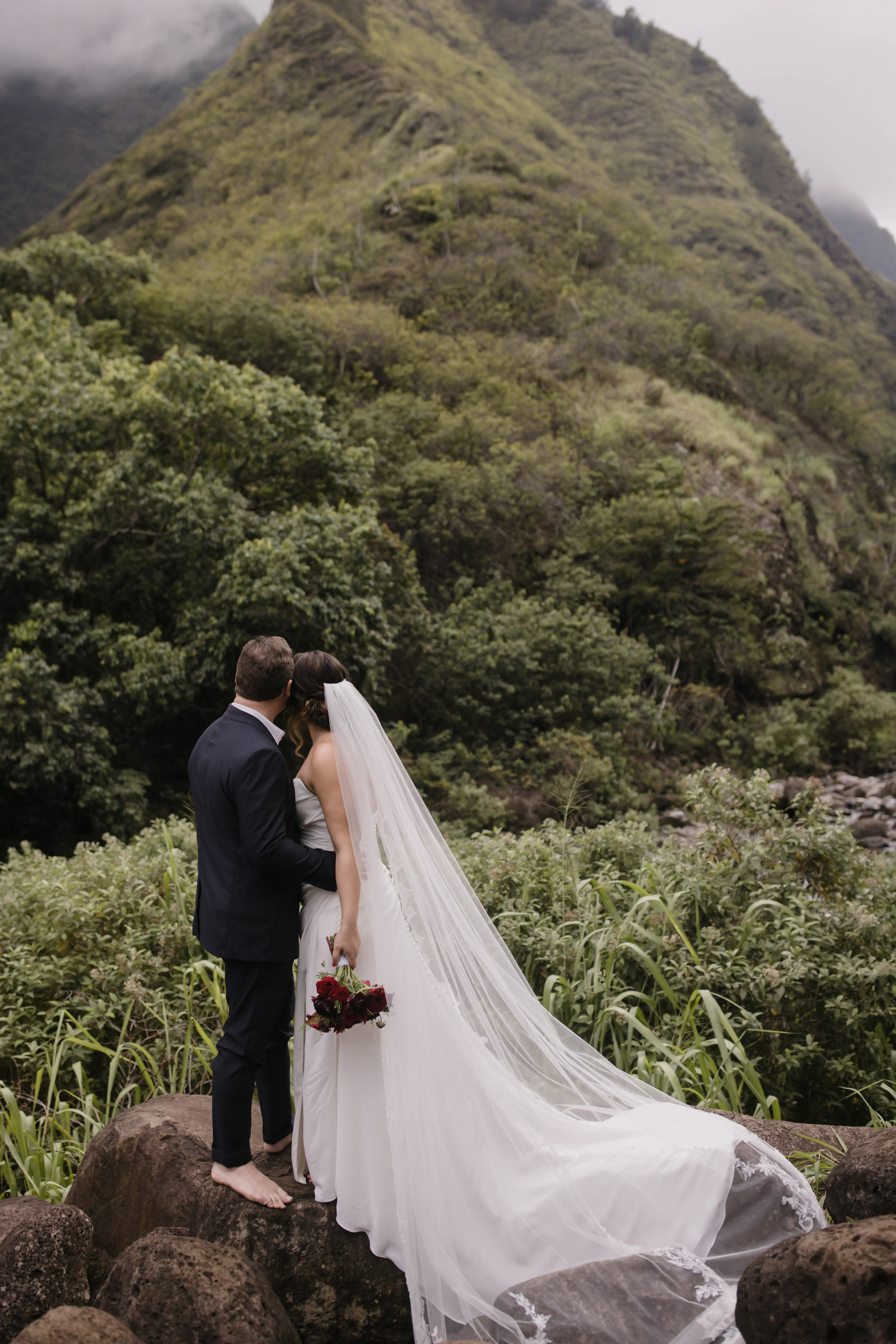 Bride On Beach With Groom In Strapless Wedding Dress Called Monaco By Maggie Sottero
