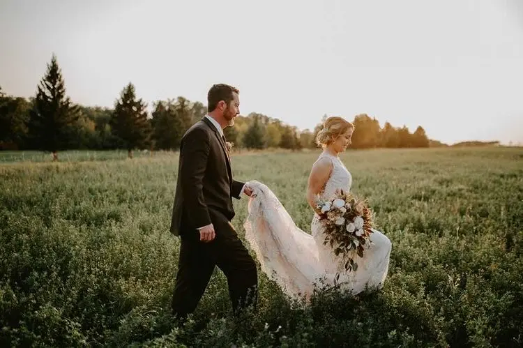 Groom With Bride Wearing Lace Wedding Dress With Illusion Back Verina Marie By Maggie Sottero